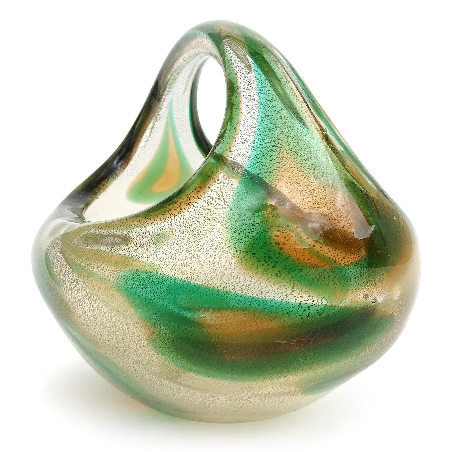 Beautiful vintage Murano hand blown Sommerso green, orange amber spots and gold flecks Italian art glass basket / vase. Documented to designer Archimede Seguso, circa 1952. Published design in many books. It has a camouflage design, profusely