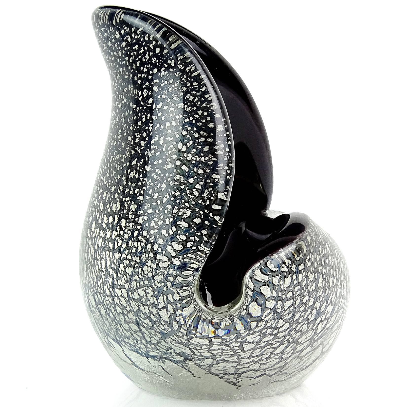 Murano handblown black with silver flecks Italian art glass conch seashell shape bowl or sculpture. Attributed to designer Archimede Seguso. Created in the same shape designed by Flavio Poli for Seguso Vetri d'Arte. Measures 6 1/4