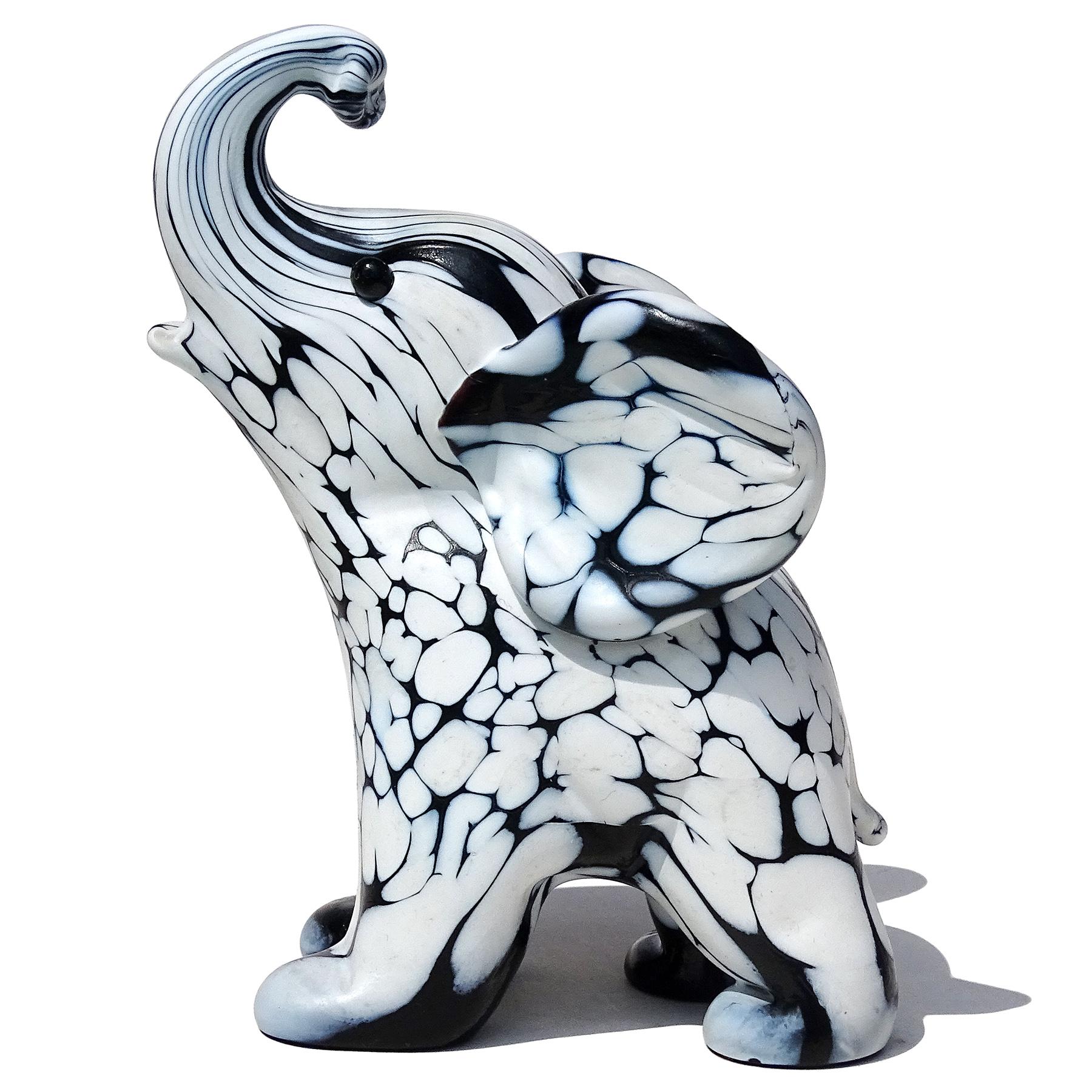 Beautiful vintage Murano hand blown black and white spotted Italian art glass baby elephant figurine sculpture. Documented to designer Archimede Seguso, from the 