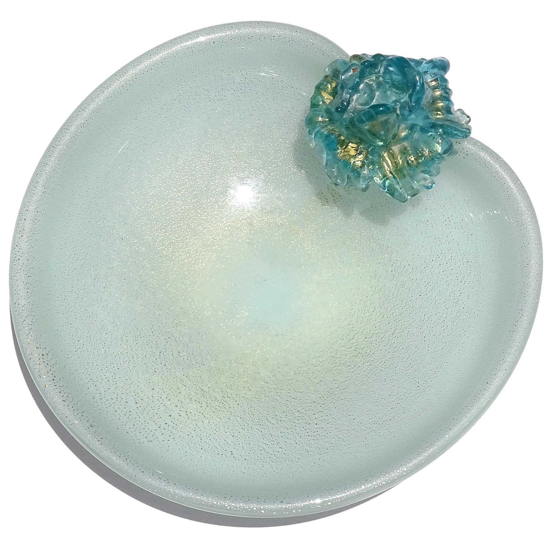 Beautiful vintage Murano hand blown light blue, white and gold flecks Italian art glass decorative vide-poche bowl. Attributed to designer Archimede Seguso. The bowl has an applied blue and gold leaf flower placed at the top edge of the rim. The