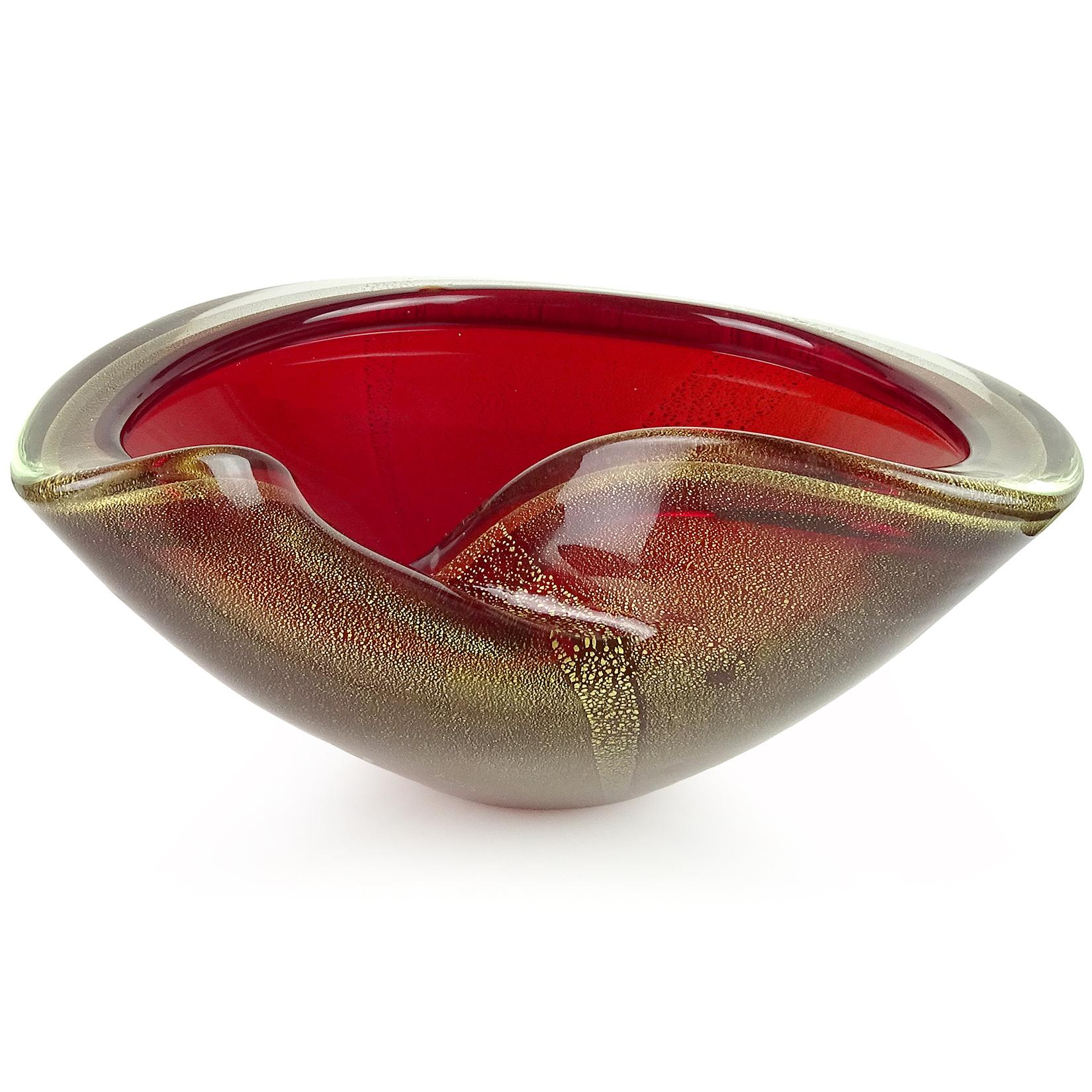 Beautiful vintage Murano hand blown red and gold flecks Italian art glass bowl. Attributed to designer Archimede Seguso. The piece is profusely covered in gold leaf with folded over rim and decorative fold. Would make a great display piece on any