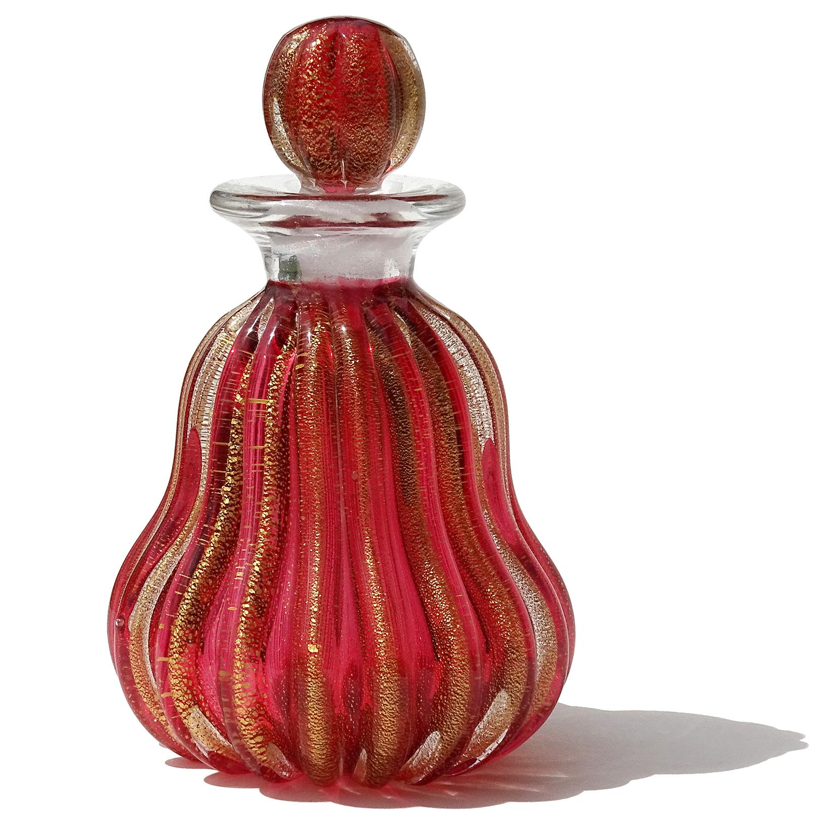 Beautiful vintage Murano hand blown Sommerso cranberry red and gold flecks Italian art glass perfume bottle. Published and documented to designer Archimede Seguso, circa 1950s. Has an original 