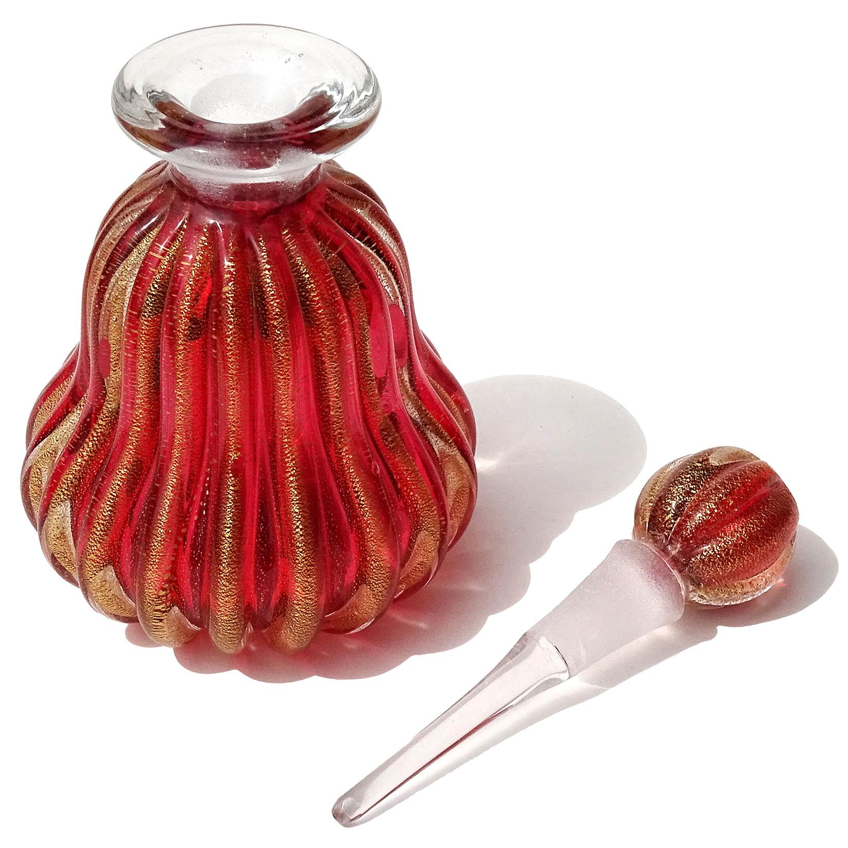 red and gold perfume bottle
