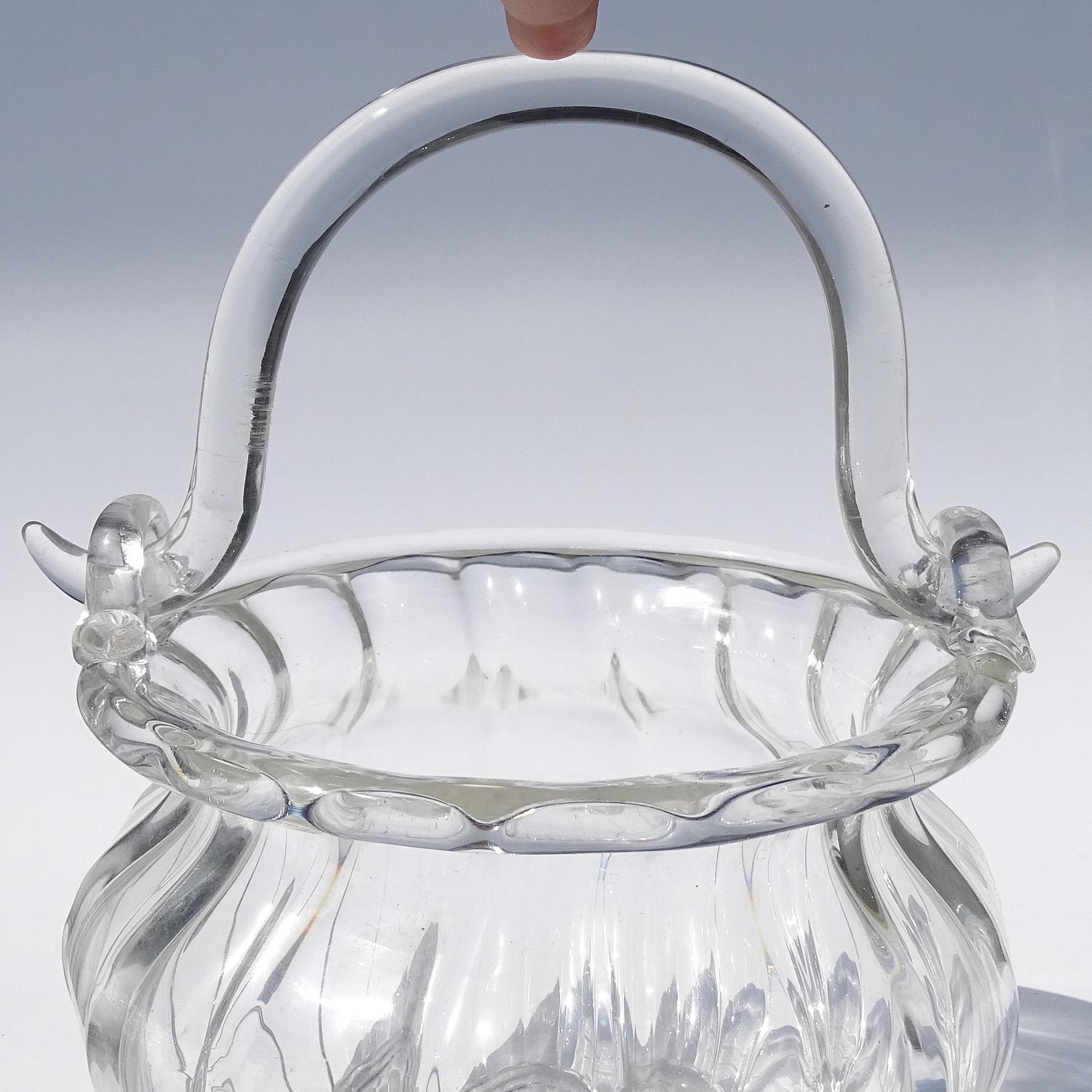 Beautiful vintage Murano hand blown crystal clear Italian art glass ribbed working handle flower basket / vase. Documented to designer Archimede Seguso. The basket has an original 