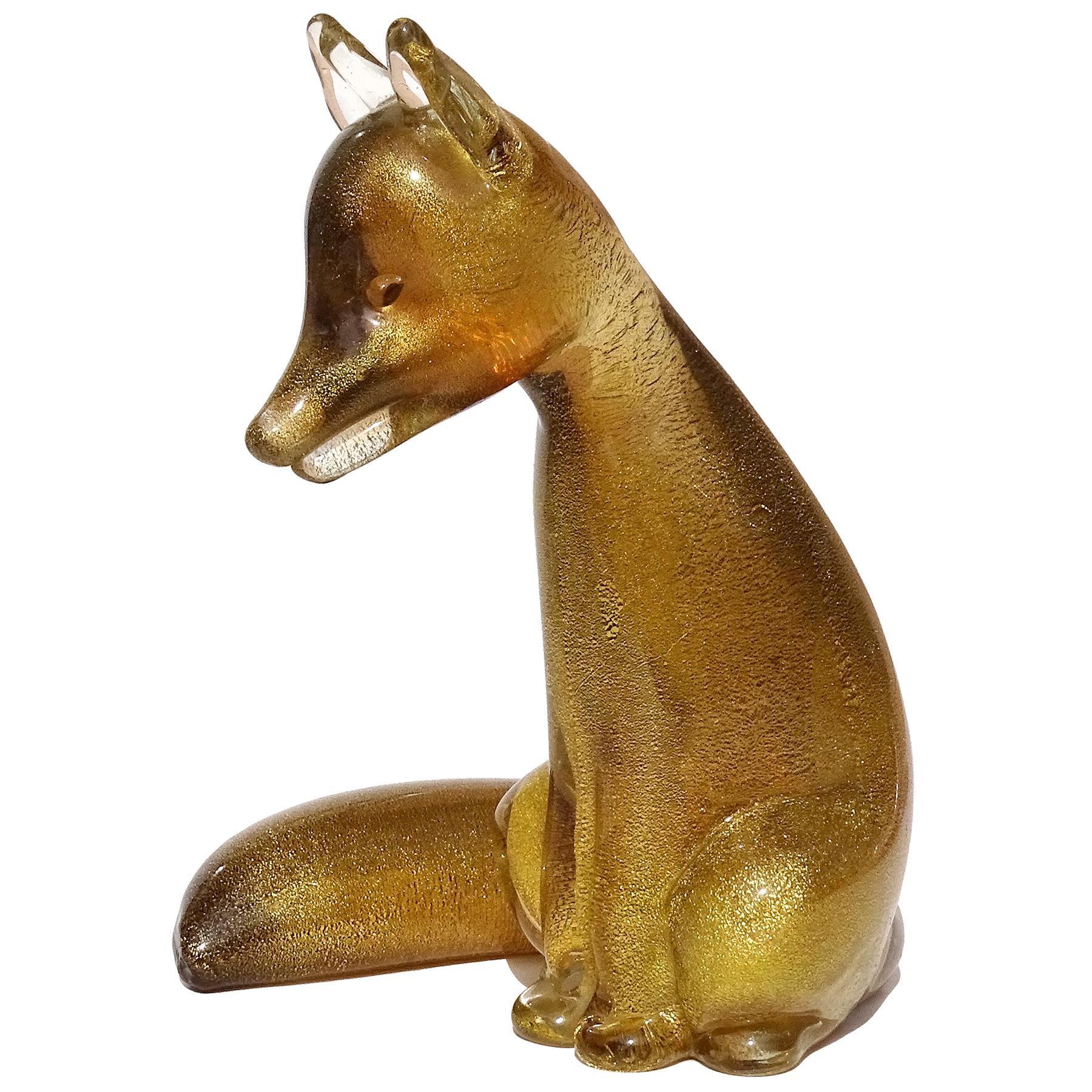 Beautiful and rare, vintage Murano hand blown Sommerso dark amber and gold flecks Italian art glass fox sculpture / figure. Attributed to designer Archimede Seguso, and similar to Seguso Vetri d'Arte foxes shown in their book. The fox is beautiful