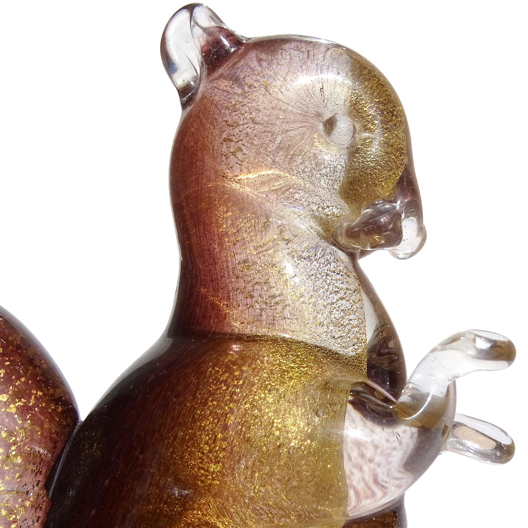 Beautiful vintage Murano hand blown dark amethyst and gold flecks Italian art glass decorative squirrel figurine / sculpture. Documented to designer Archimede Seguso, circa 1950s. Created with powder pigments, 