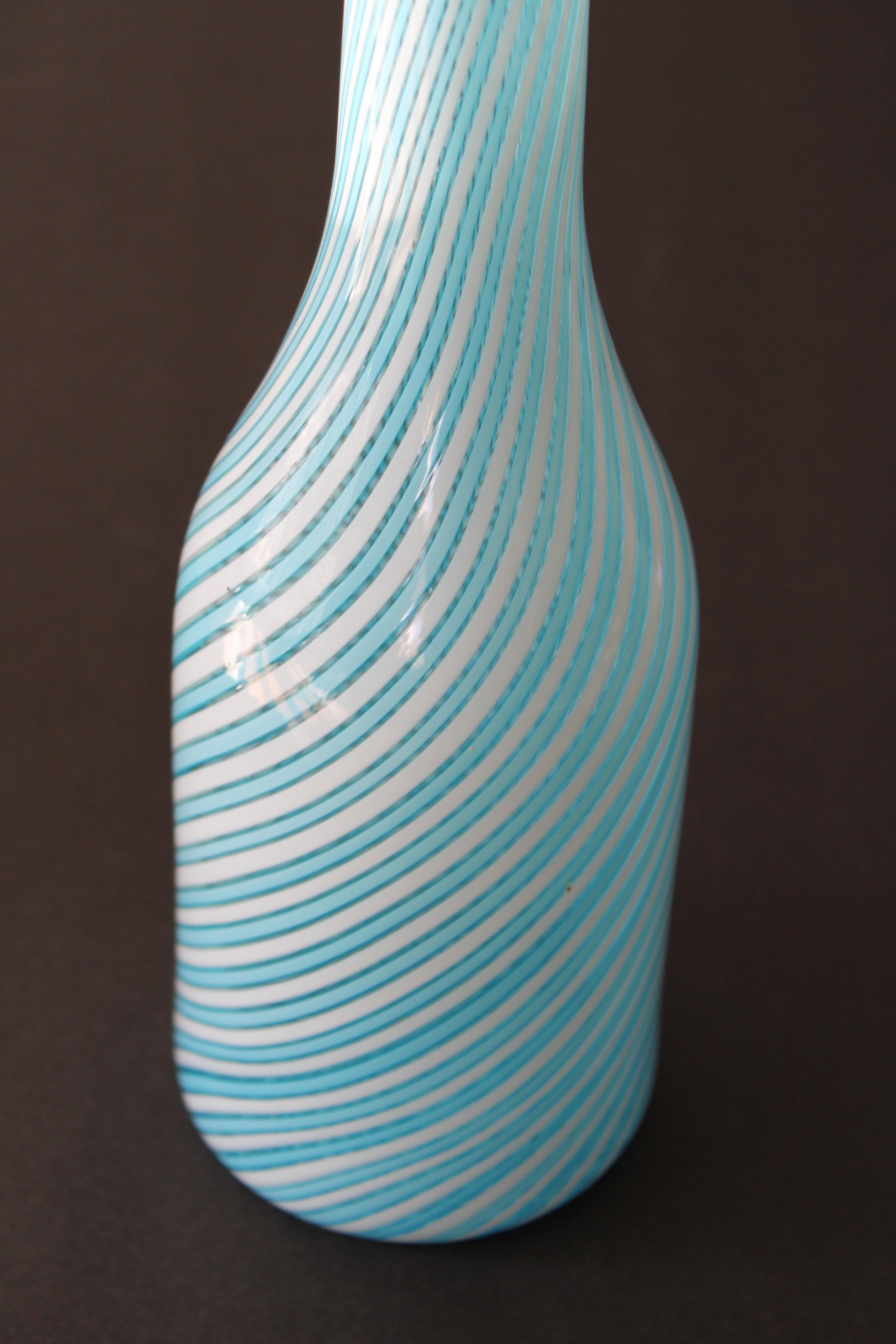 Seguso Murano vase with a turquoise and white pattern. Vase contains label that says Murano Glass made in Italy. Vase measures 15