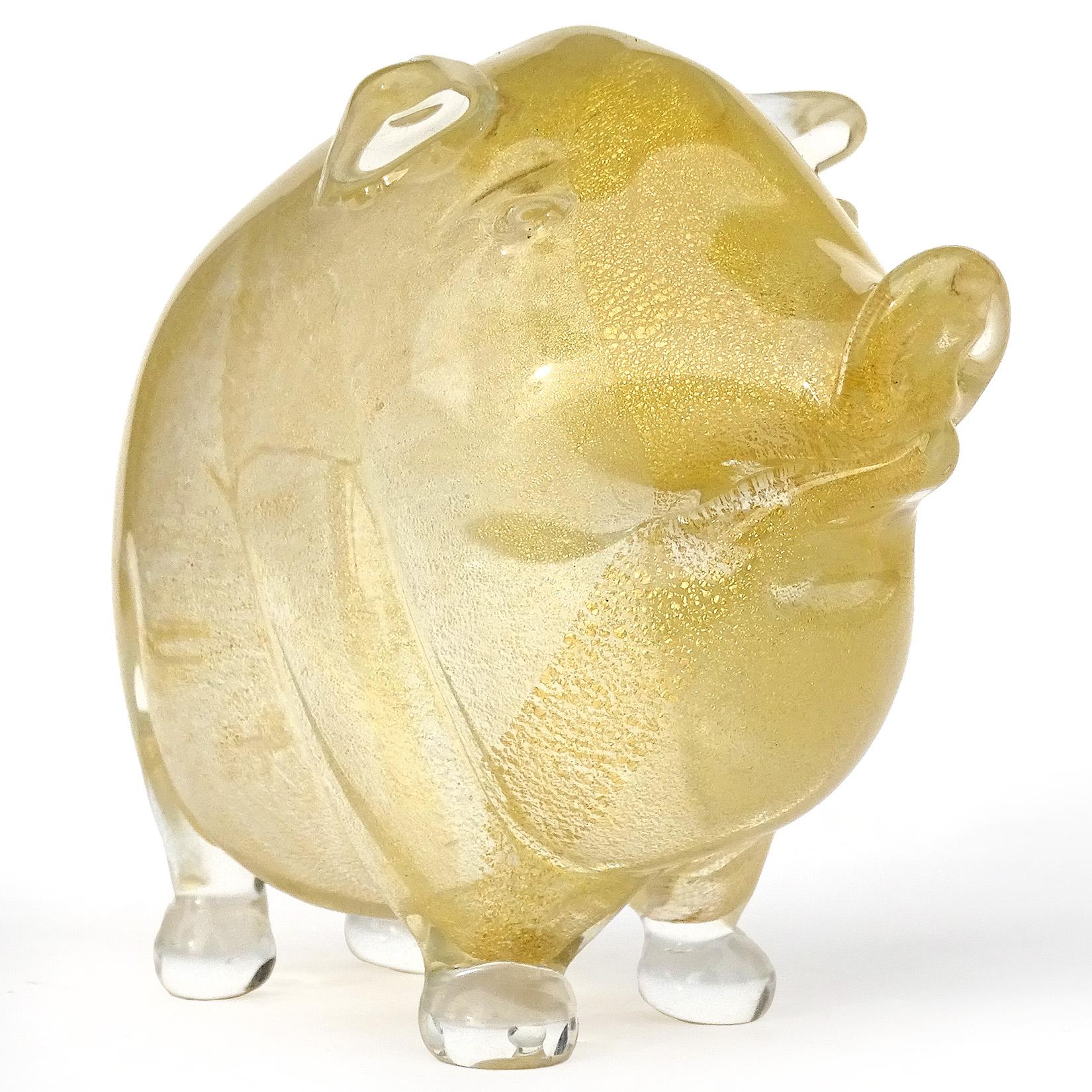 Beautiful vintage Murano hand blown clear and gold flecks Italian art glass little pig figurine. Created in the manner of the Seguso Vetri d'Arte, and Archimede Seguso workshops. The pig is profusely covered in gold leaf, and has a curly tail.