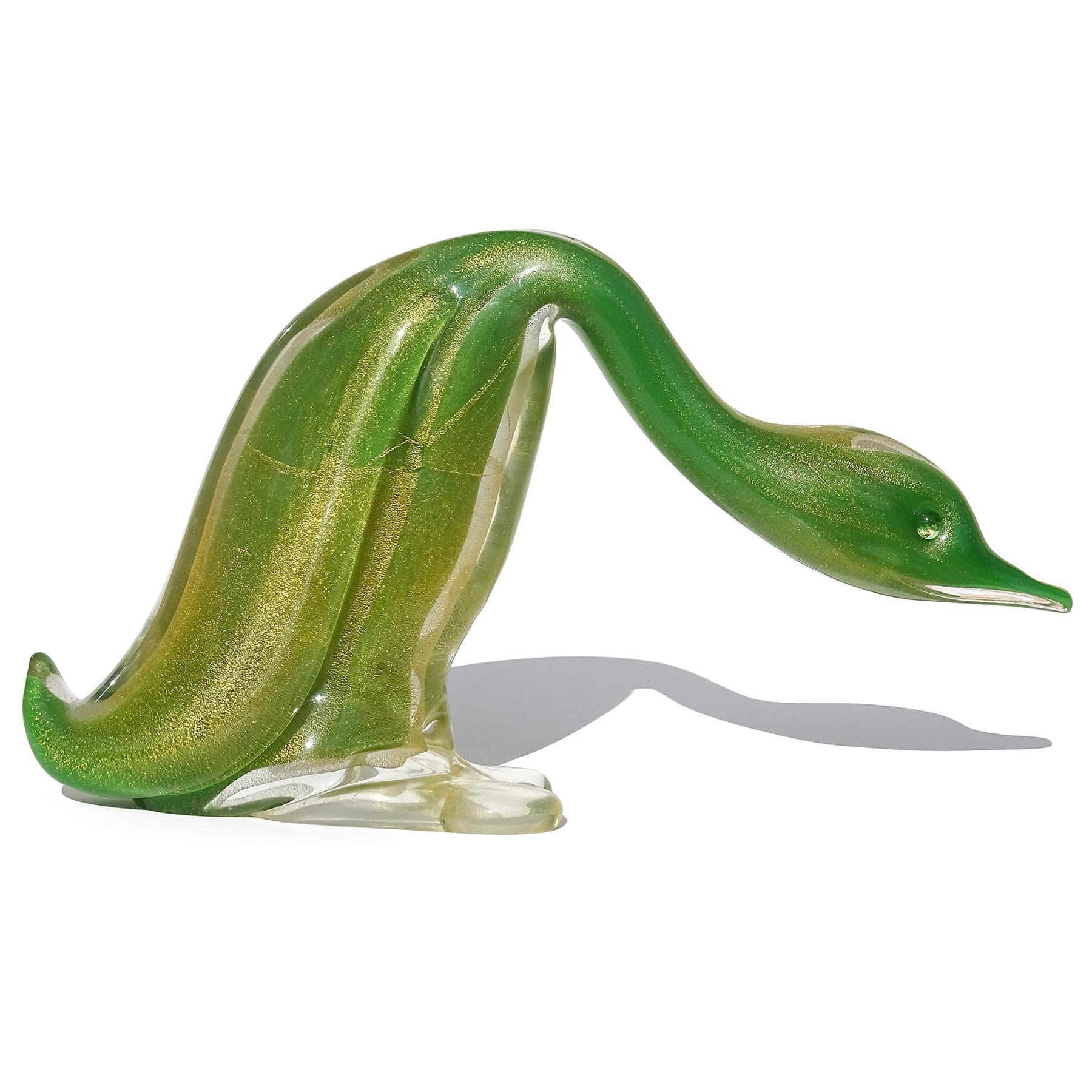 Beautiful, extra large, vintage Murano hand blown green and gold flecks Italian art glass duck bird figure / sculpture. Documented to designer Archimede Seguso. Similar ones are published in the Seguso books. The duck has an inner layer of bright
