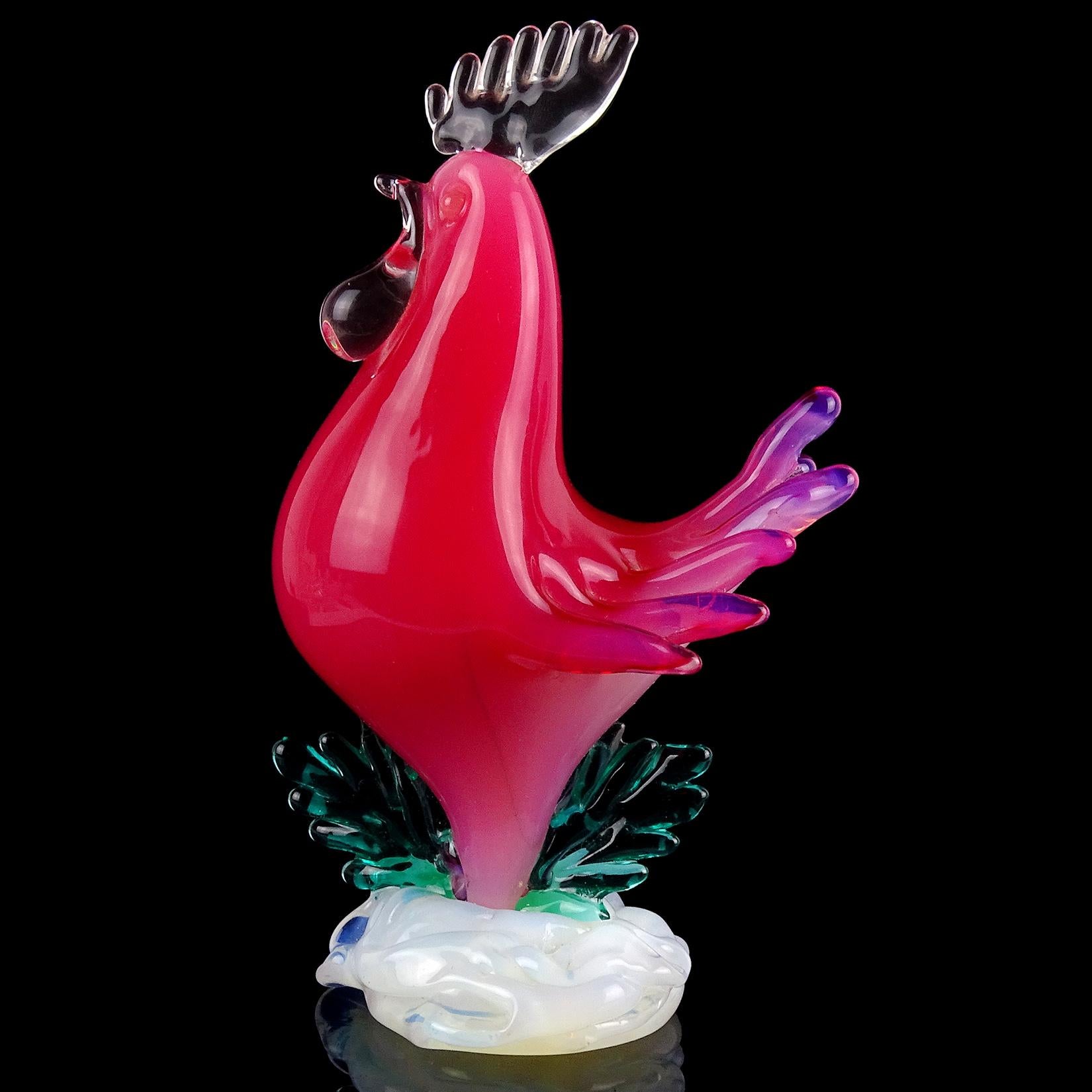 Beautiful vintage Murano hand blown, dark opalescent pink, white and green Italian art glass rooster sculpture. Documented to the Seguso Vetri d'Arte company. The bird stands proudly, with large comb, pushed out chest and flared tail. The base has