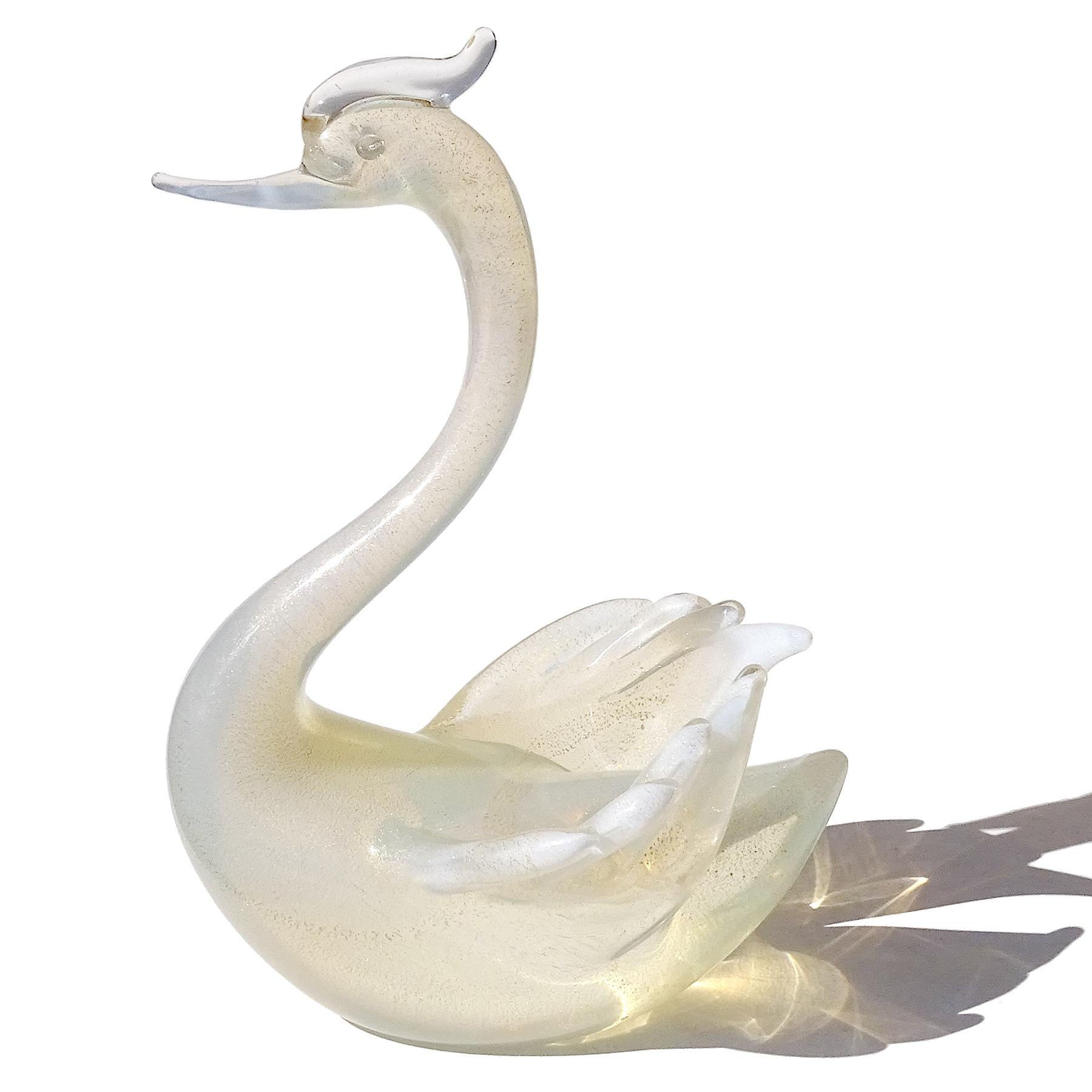 Beautiful vintage Murano hand blown white opalescent and gold flecks Italian art glass swan bird sculpture / figure. Documented to designer Archimede Seguso. Very elegant shape, with elongated neck and finely detailed wings. The bird has white