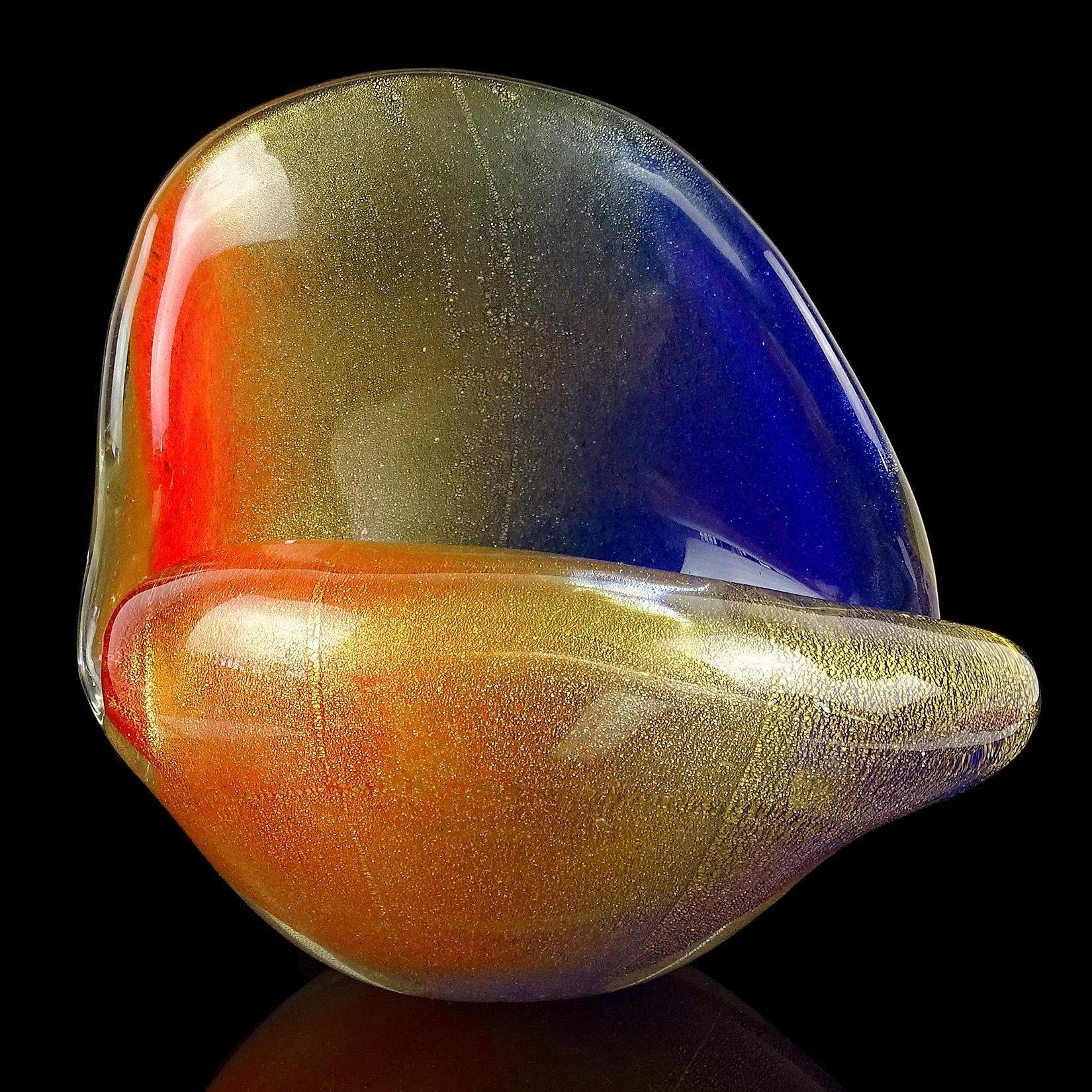 Rare and unique vintage Murano hand blown gold flecks with orange and blue pigments Italian art glass conch seashell sculpture. Documented to designer Archimede Seguso, in the Pulveri design, circa 1950s. It is very unusual to find this technique