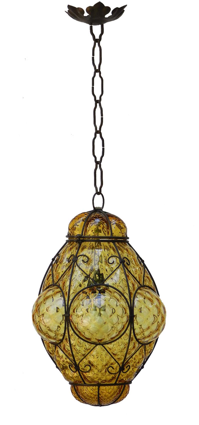 Seguso Murano pendant light Italian vintage handblown amber bubble glass midcentury
Manufactured by Seguso in the 1960s.
It is made from handblown amber colored glass with a black coloured metal cage.
Sometimes known as Ali Baba lights
The top