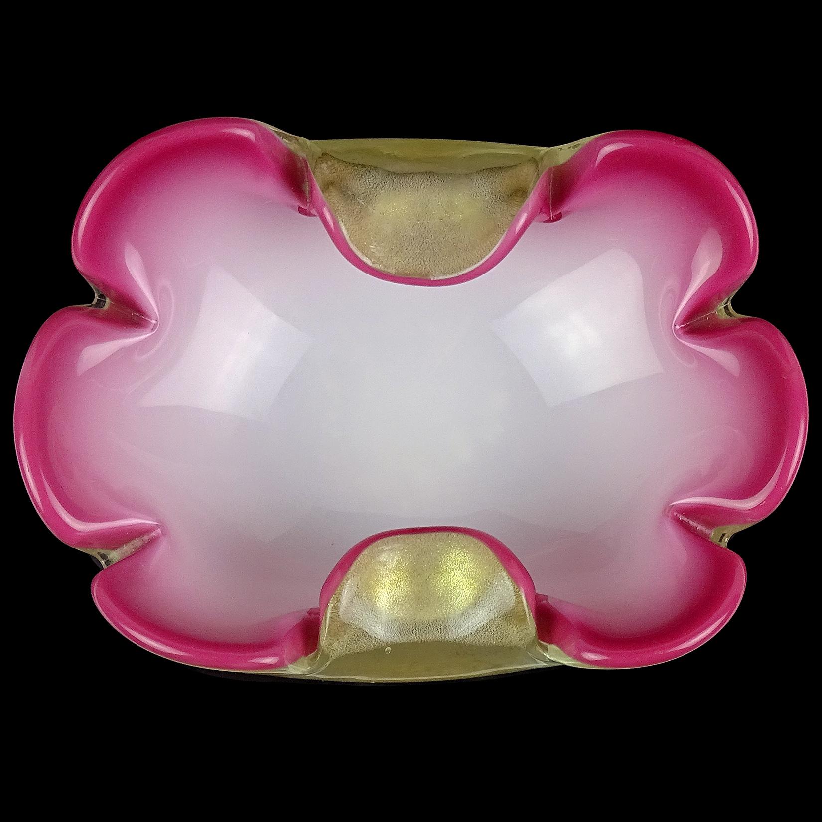 Beautiful vintage Murano hand blown dark pink, white and gold flecks Italian art glass flower shaped bowl. Attributed to designer Archimede Seguso. The bowl is profusely covered in gold leaf on the outside, with 2 petals folded in at the sides. The