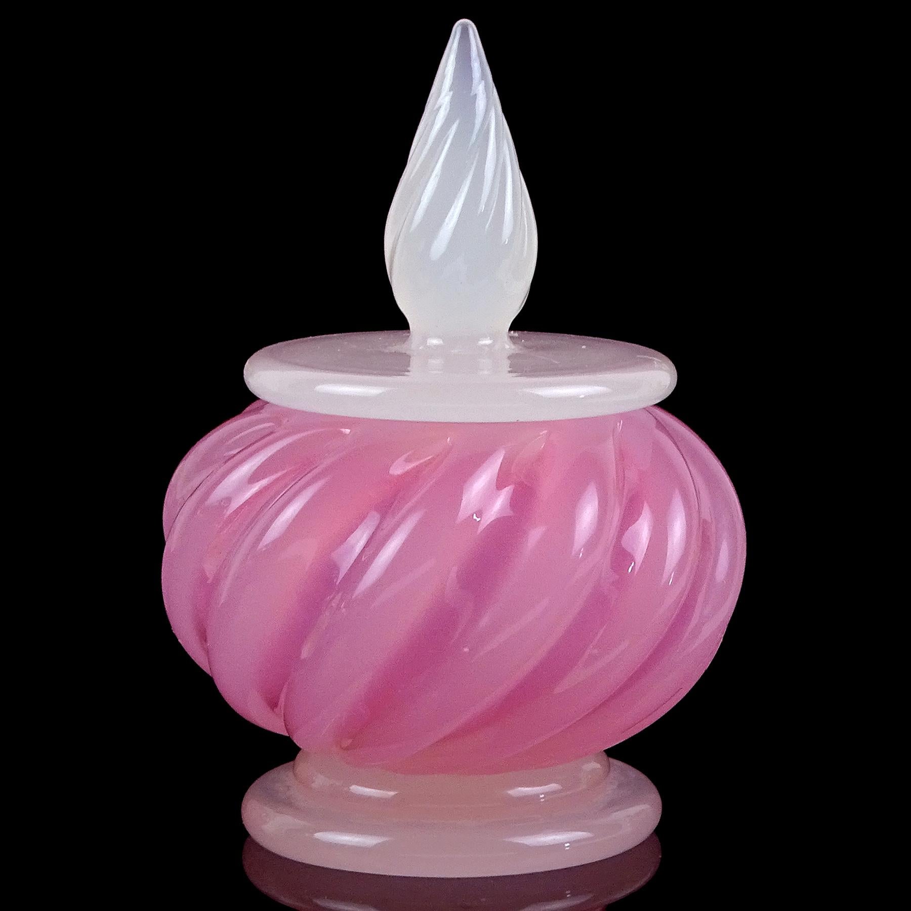 Beautiful vintage Murano hand blown opalescent white and pink Italian art glass vanity powder box / jar. Documented to designer Archimede Seguso. It has been created as part of the 