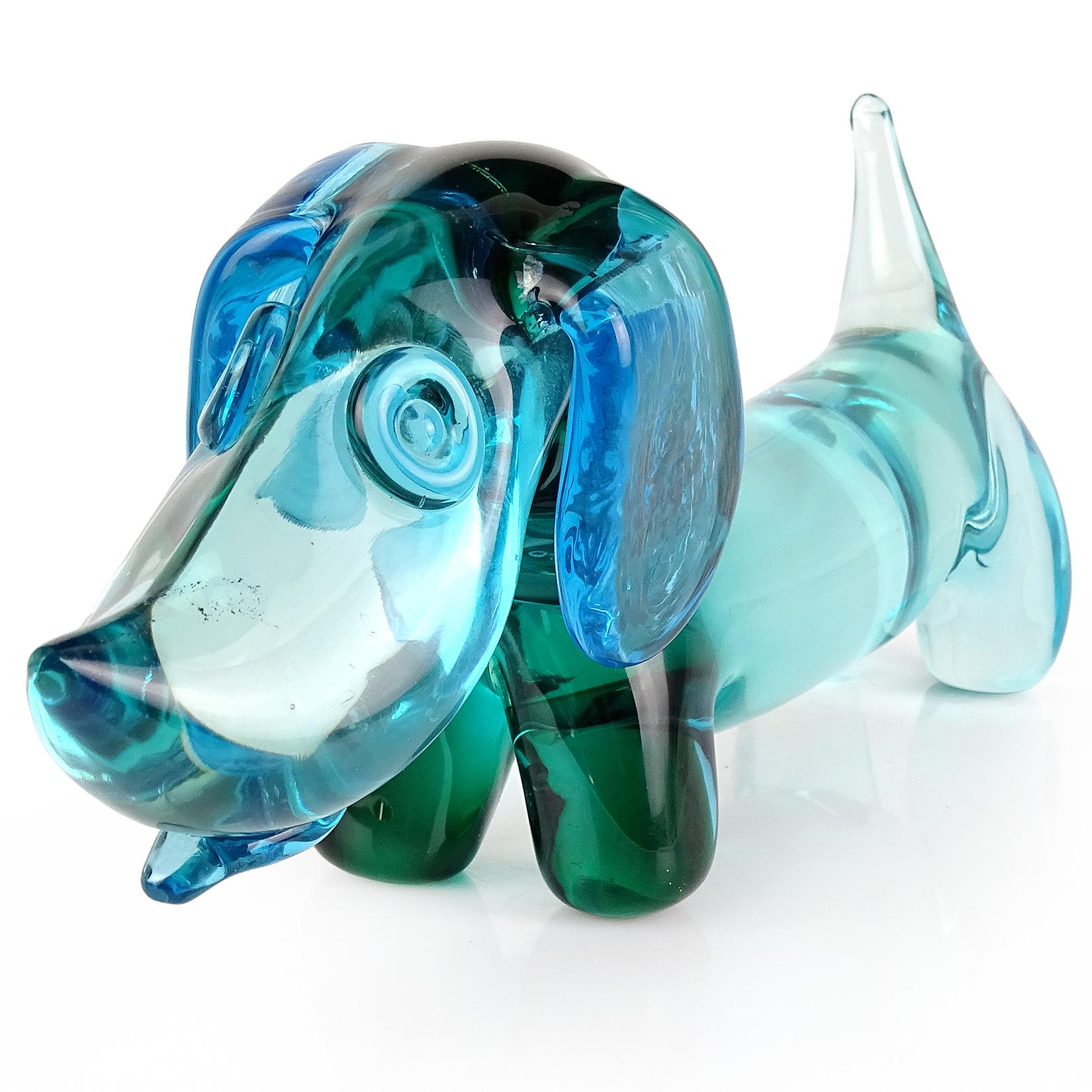 Beautiful and cute Murano hand blown Sommerso aqua, blue, green, Italian art glass Dachshund puppy dog sculpture. Documented to designer Archimede Seguso. The puppy has a blue collar, ears, and tongue sticking out. A must for the dog lover in your