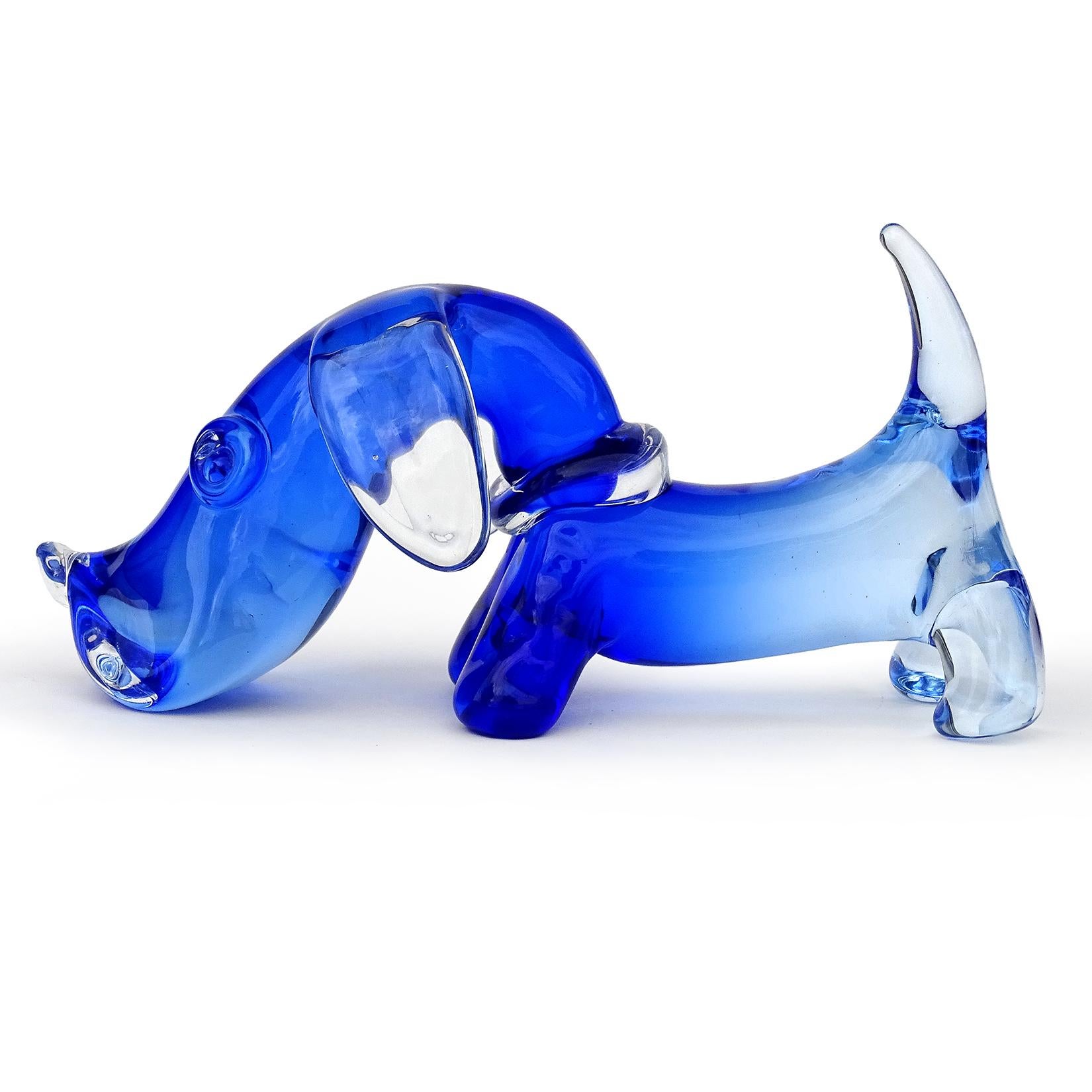 Beautiful and very cute, vintage Murano hand blown Sommerso cobalt to light blue Italian art glass Dachshund puppy dog sculpture. Documented to designer Archimede Seguso. The dog has a clear collar, ears, and tongue sticking out. A must for the dog