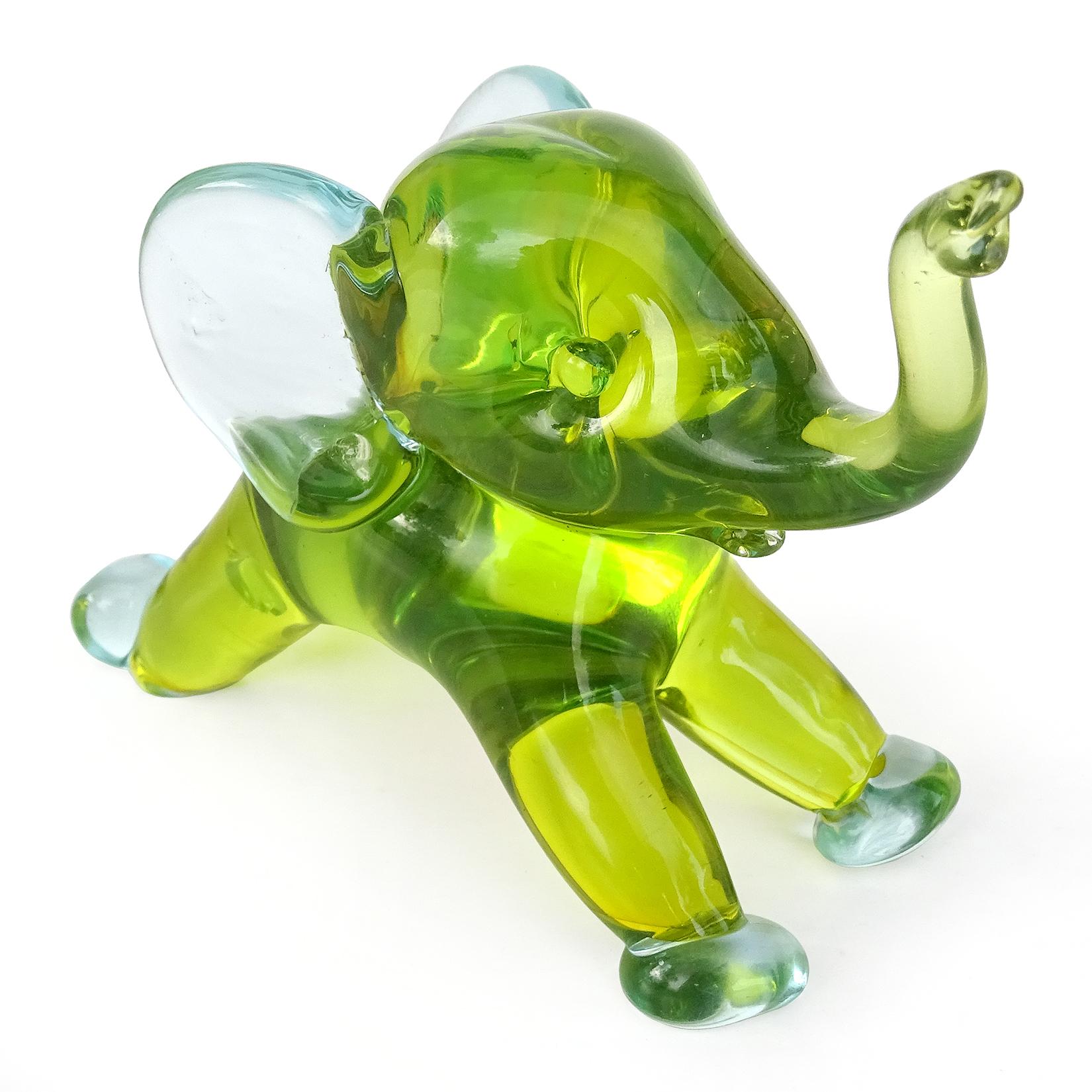 Beautiful vintage Murano hand blown Sommerso green with blue Italian art glass running baby elephant sculpture / figurine. Documented to designer Archimede Seguso. The figure still has a 