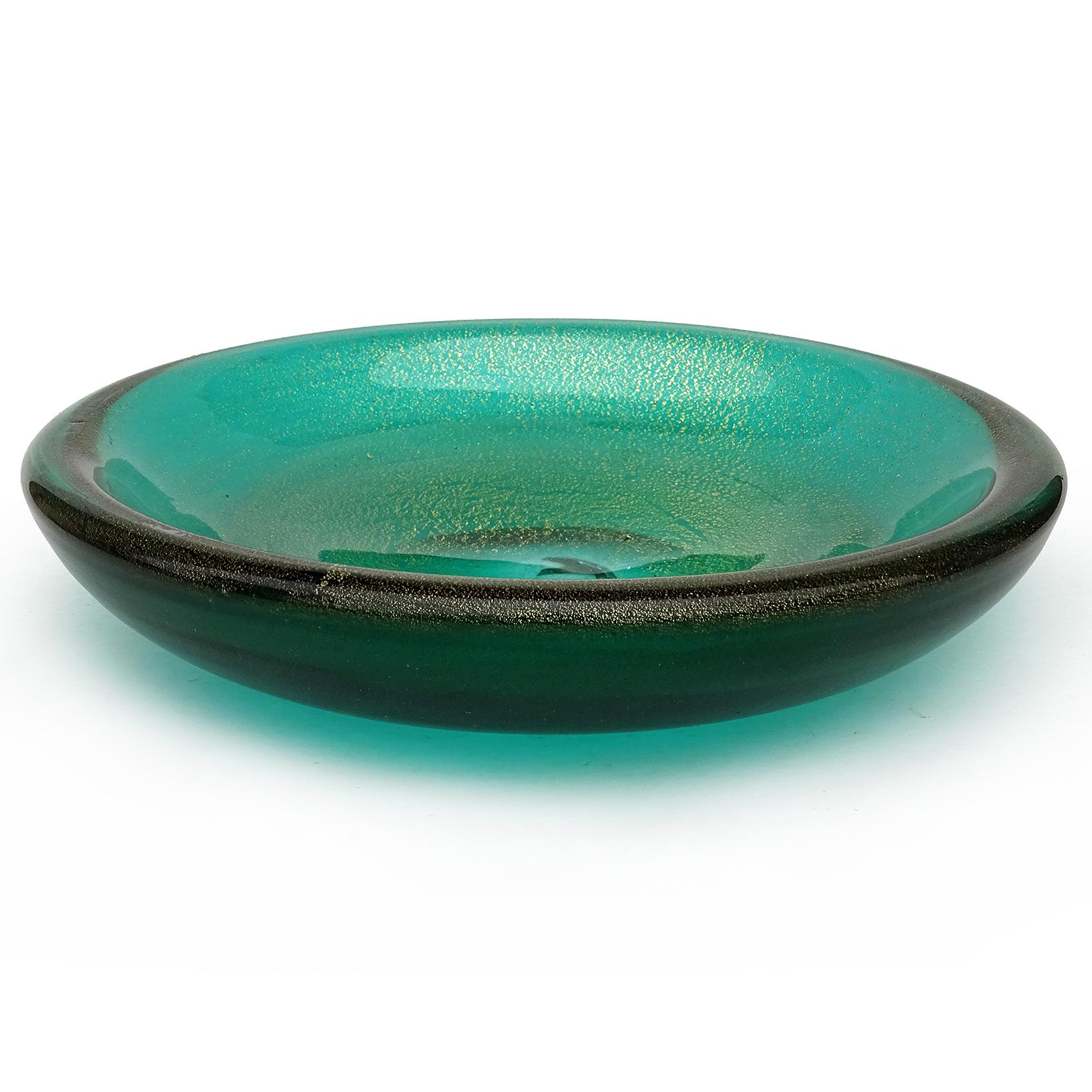 Beautiful vintage Murano hand blown Sommerso green and gold flecks Italian art glass circular bowl. Attributed to designer Archimede Seguso. Profusely covered in gold leaf. Would make a great display piece on any table. Use it as a catchall, or