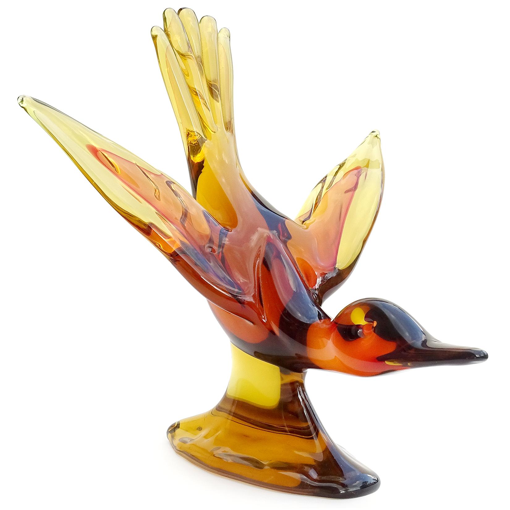 Beautiful, extra large, vintage Murano hand blown Sommerso golden yellow orange over red, Italian art glass flying duck centerpiece sculpture. Documented to designer Archimede Seguso. The bird has its wings outstretched with tail up like it is