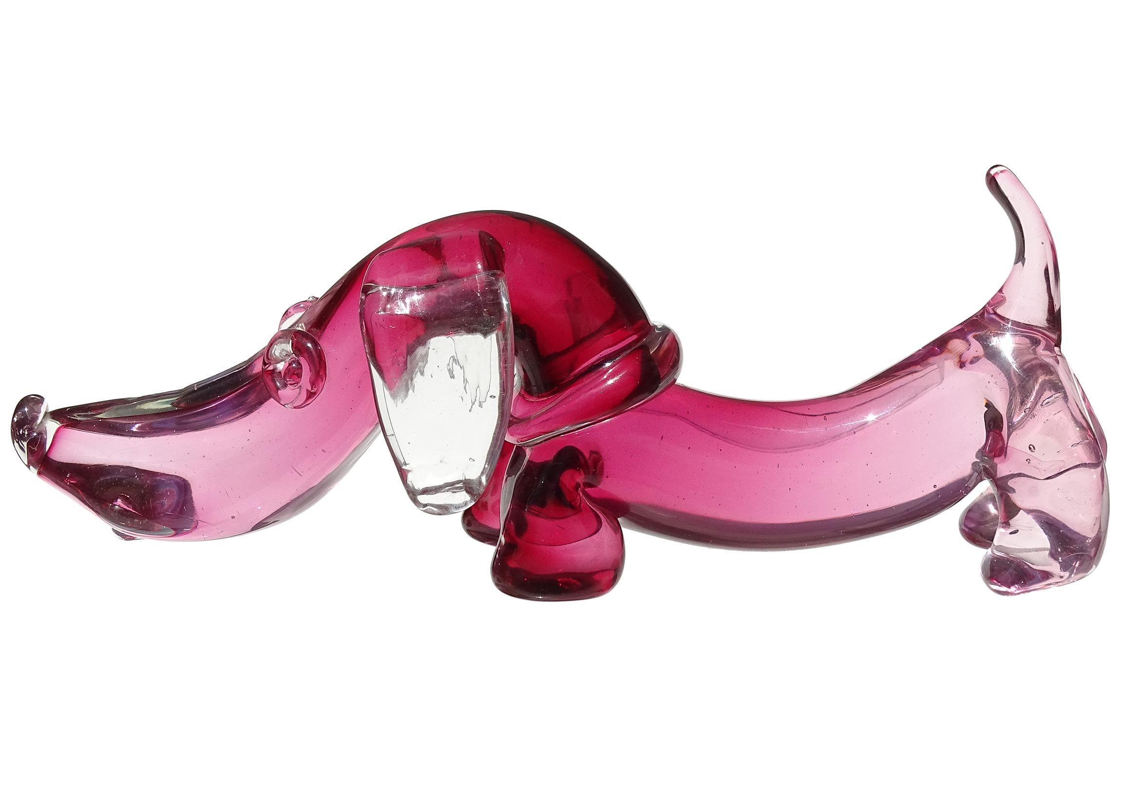 Beautiful and cute Murano hand blown Sommerso dark pink and clear Italian art glass Dachshund puppy dog sculpture. Documented to designer Archimede Seguso. The puppy has an applied collar, floppy ears, and tongue sticking out. Would make a great