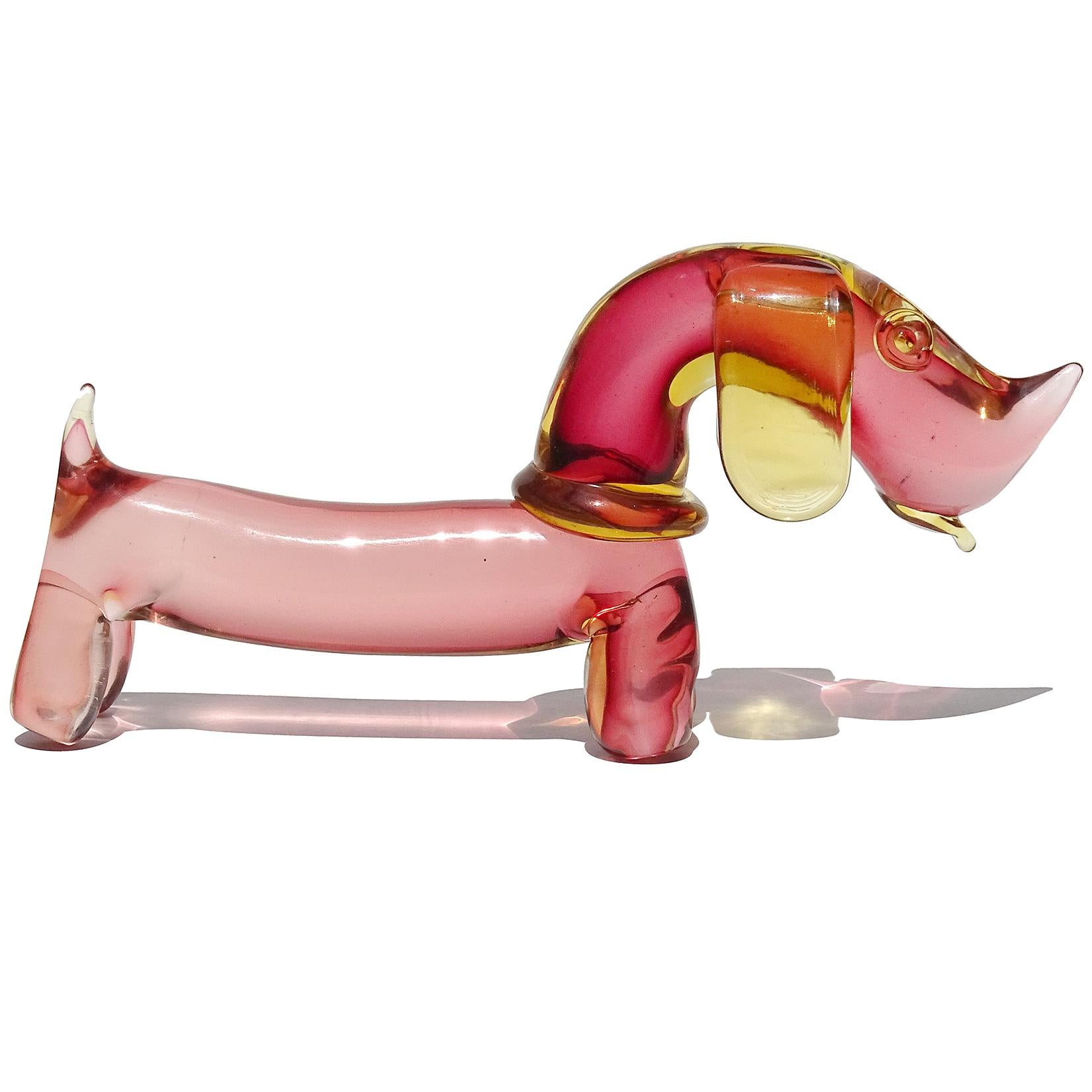 Beautiful and cute Murano hand blown Sommerso yellow orange over pink Italian art glass Dachshund puppy dog sculpture. Documented to designer Archimede Seguso. The puppy has a yellow collar, ears, and tongue sticking out. A must for the dog lover in