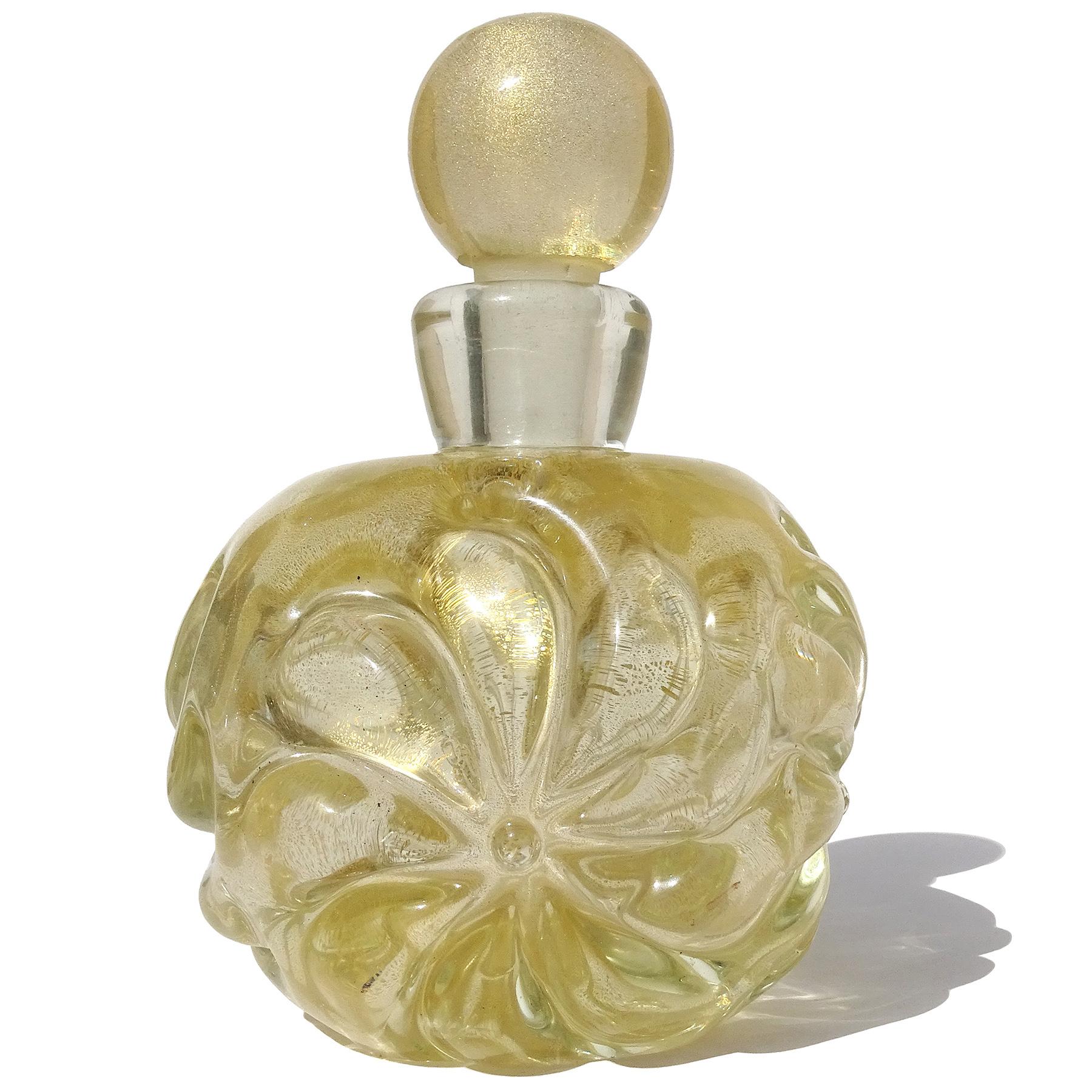 Beautiful vintage Murano hand blown Sommerso clear and gold flecks Italian art glass perfume bottle. Created in the manner of the Seguso Vetri D'Arte company, and designer Archimede Seguso. The bottle has embossed flower designs on each side, and is