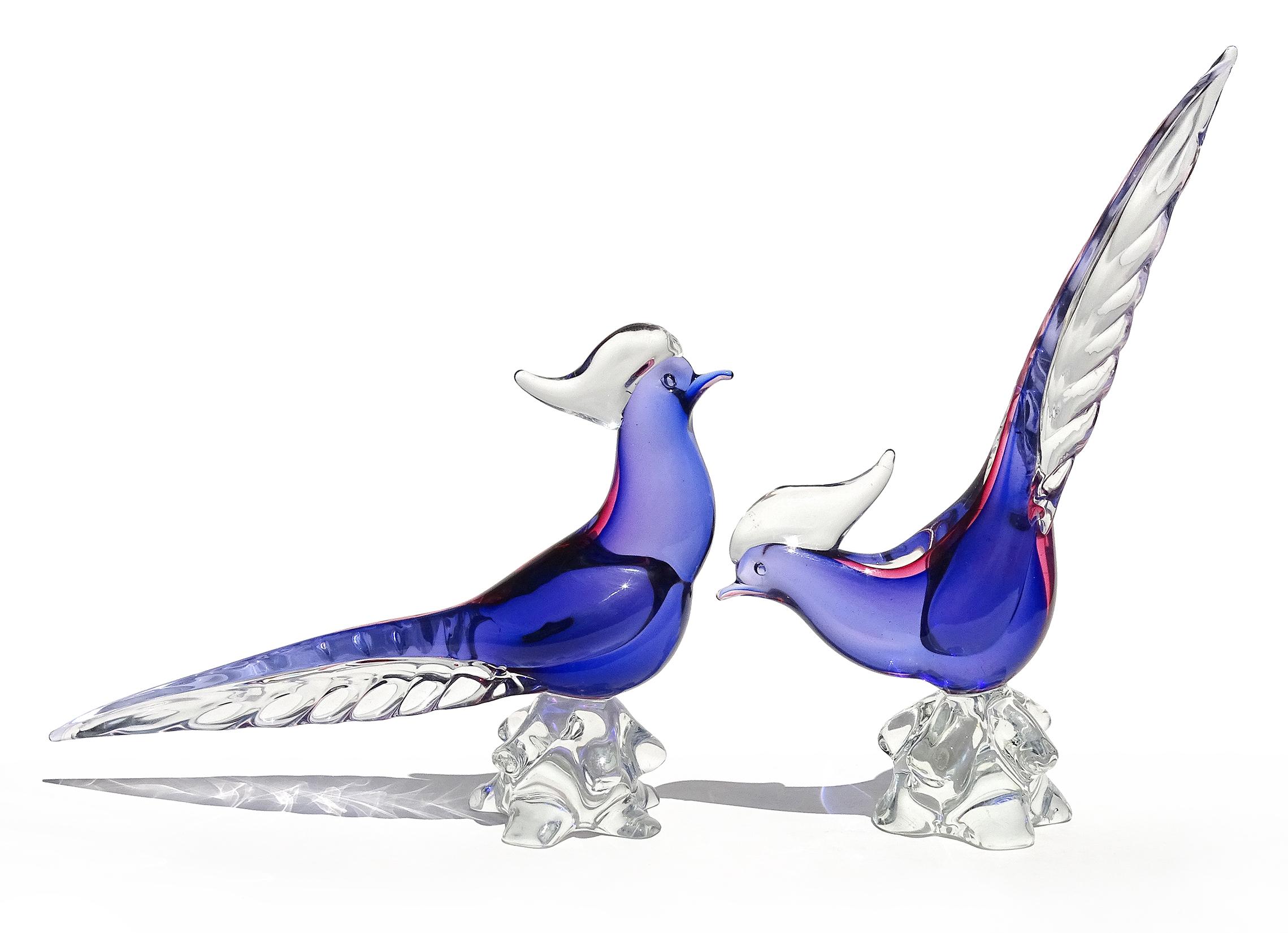 Beautiful vintage Murano hand blown Sommerso pheasant birds Italian art glass sculptures. Attributed to designer Archimede Seguso. The birds have an inner layer of blue, with over layer of ruby pink (Blu - Rubino). They look a bit purple from the