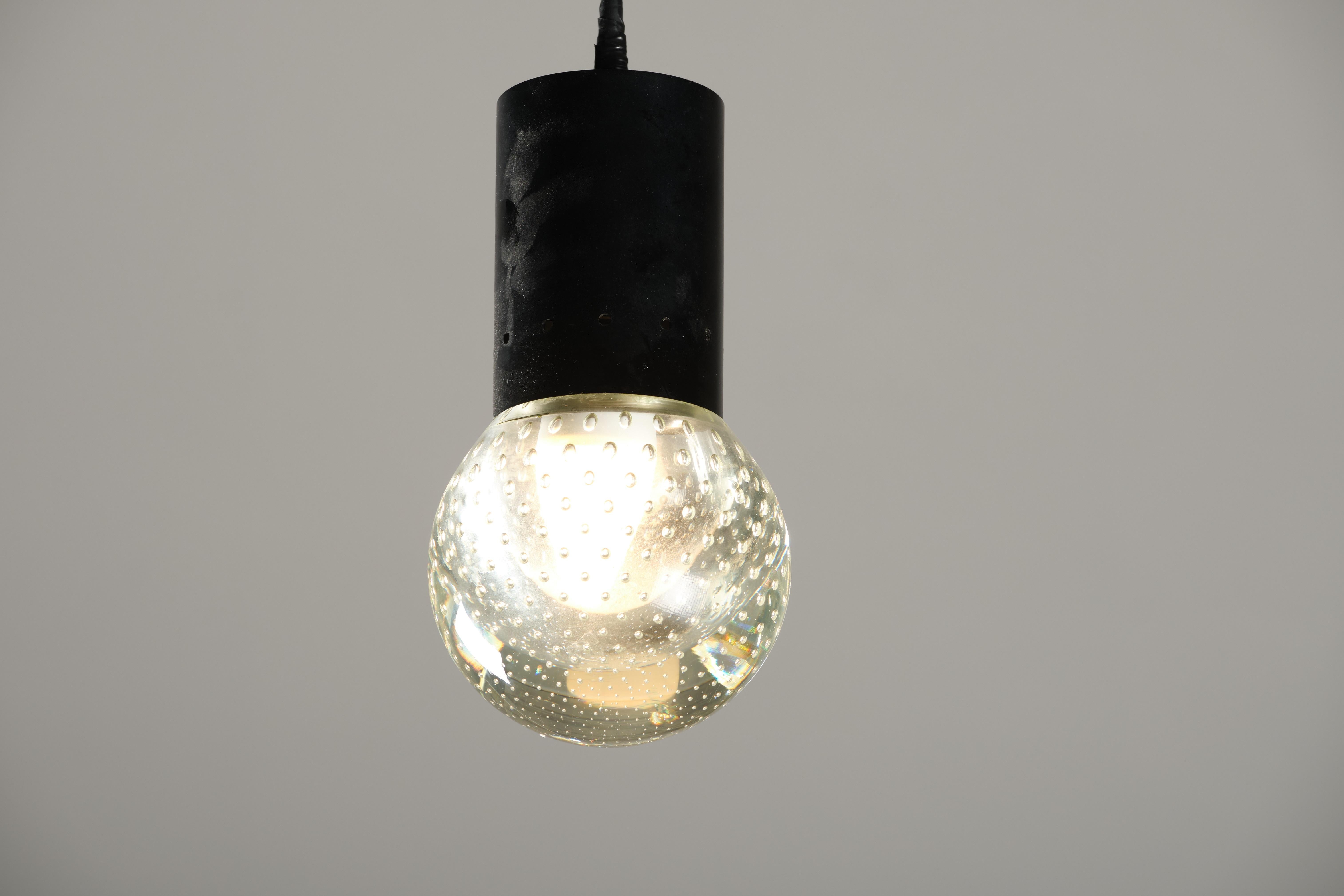 This amazing pendant is the result of unique craftsmanship of Seguso in 1960s. Its elegant spherical glass embellished with mini bubbles add a twist of creativity to this perfectly shaped item.