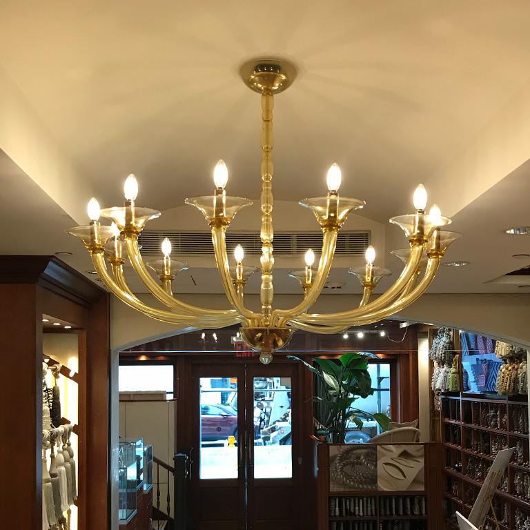 Alioth Murano glass chandelier by Seguso Vetri d'Arte. Handmade, blown Murano glass twelve lights light Amber available. Shades can be ordered separately.
This is a showroom sample and the price has been reduced from its original of 19.500.