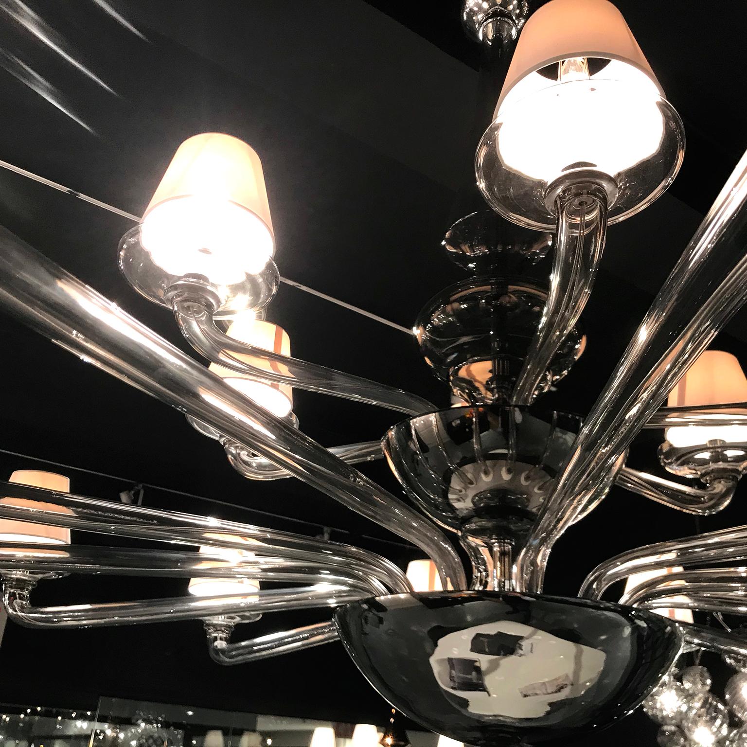 Coloniale Murano glass chandelier by Seguso Vetri d'Arte. Handmade, blown Murano glass in an elegant, refined shape inspired by midcentury designs, capturing the essence of Seguso. The chandelier is made in grey transparent glass, creating a