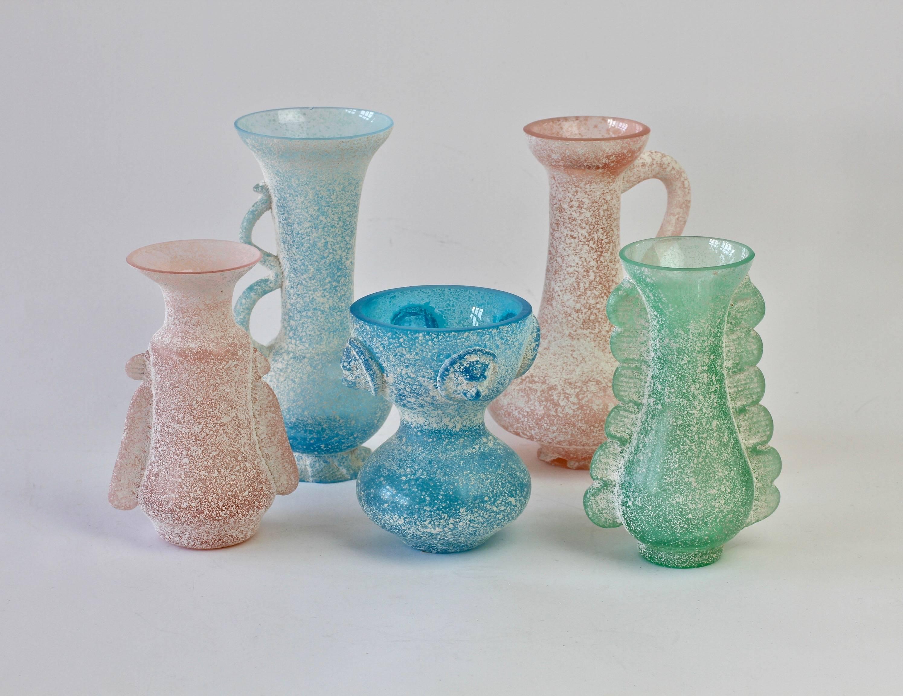 Wonderful collection / ensemble of 'a Scavo' colored / coloured glass vases and vessels, some of which have been attributed to Vittorio Rigatierri for Seguso Vetri d'Arte Murano, Italy, circa 1980s. Elegant in form and showing extraordinary