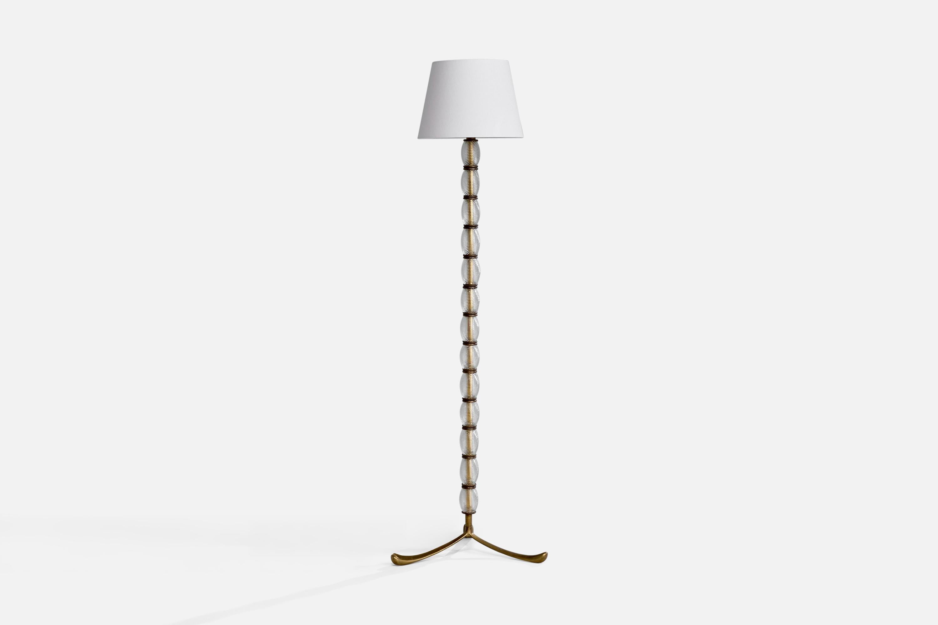 A brass, Murano glass and white fabric floor lamp produced by Seguso Vetri d'Arte, Italy, c. 1940s.

The brass legs present with moderate oxidation.

Brand new fabric shade.

Dimensions of Lamp with Shade (inches): 65.7“ H x 14“ Diameter

Bulb