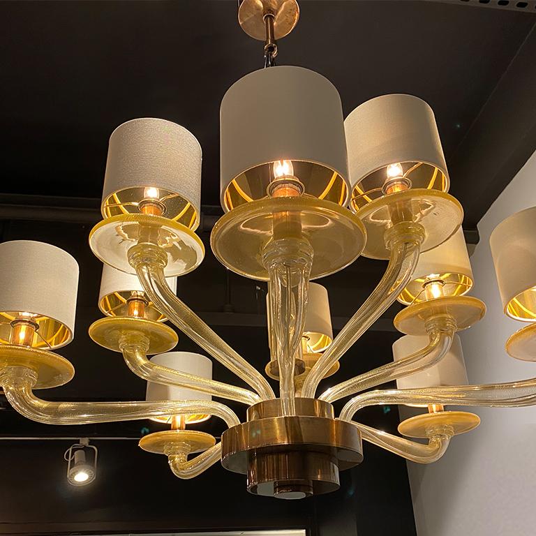 The Eila' chandelier, clear gold glass with burnished metal. Seguso Vetri d'Arte chandelier embody the nature of timeless Seguso style. The technique, color and translucencies, are ideal for a small room. Is with 10 lights in two level, completely