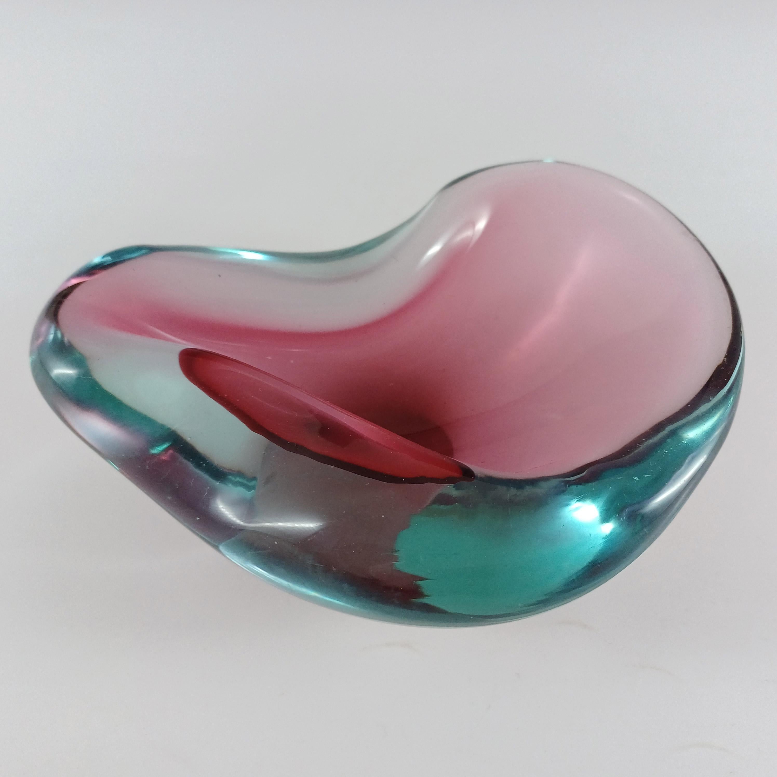 Here is a wonderful Venetian pink & blue cased glass biomorphic ashtray bowl, made on the island of Murano, near Venice, Italy. Attributed to Seguso Vetri d'Arte, and quite possibly designed by Flavio Poli, based on similar designs shown in the