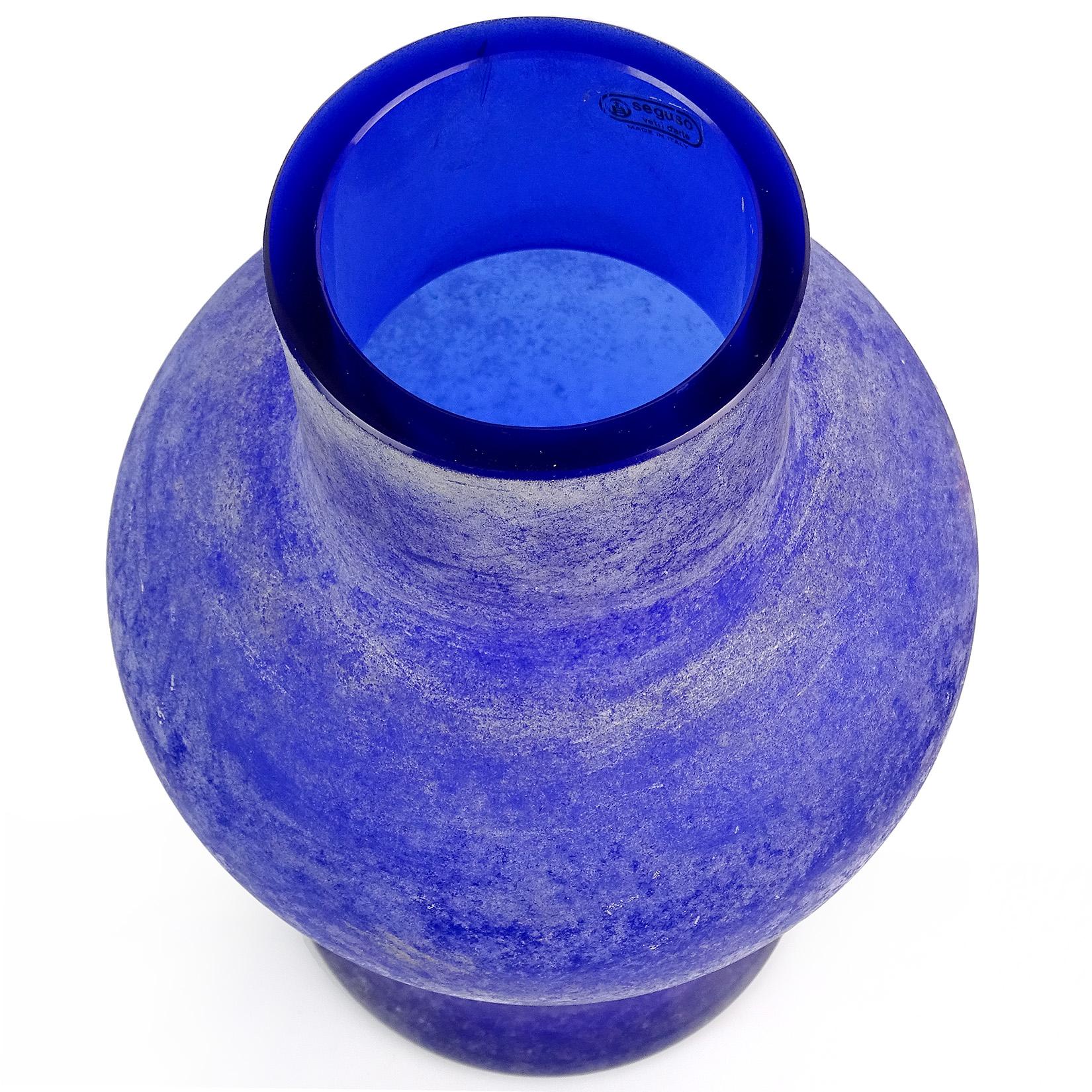 Large Murano handblown cobalt blue Italian art glass flower vase with excavated surface. Documented to the Seguso Vetri d’Arte company, in the Scavo technique, circa 1970s. It still retains an original label. Has a Roman and Greek look. Measures: 13