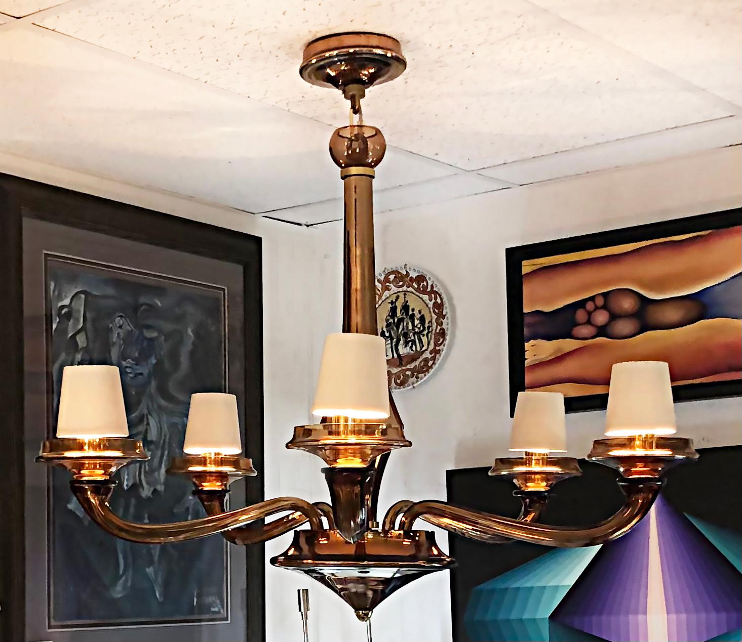 Seguso Vetri D'Arte Murano glass chandelier for Donghia, 1990s, two available 

Offered for sale are two Seguso Vetri D'Arte Murano glass chandeliers for Donghia, circa the 1990's. These lamps are priced individually and include shades, canopies,