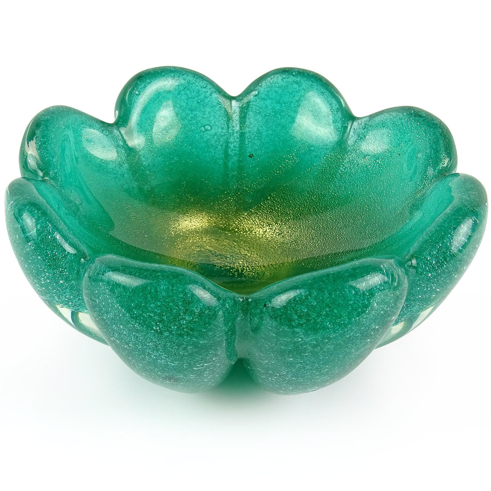 Beautiful Murano hand blown green, bubbles and gold flecks Italian art glass flower shaped bowl. Documented to designers to Flavio Poli and Archimede Seguso for Seguso Vetri d' Arte. The piece is very thick, and done in the 