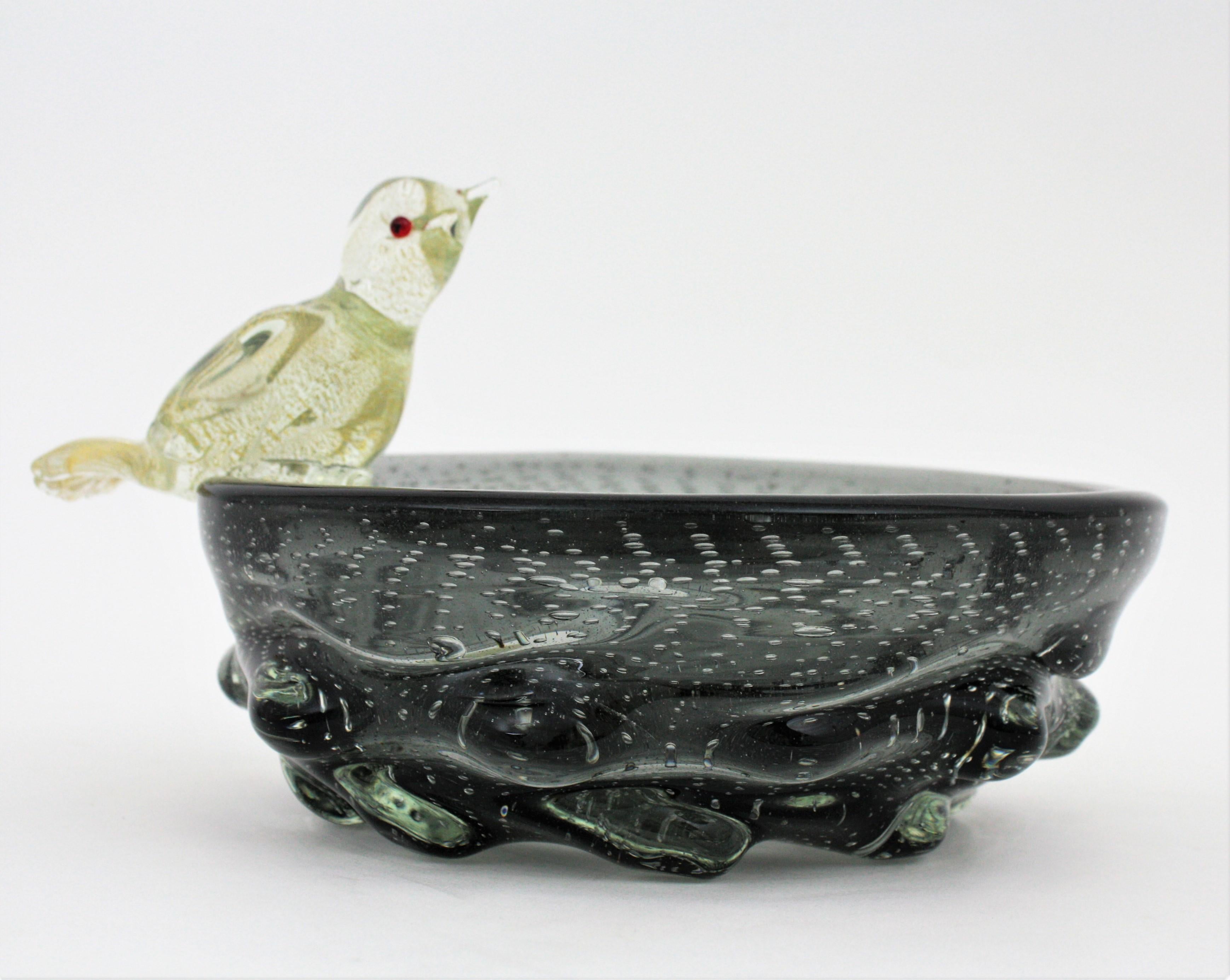 One of a Kind Murano art glass large bird bowl or centerpiece with controlled bubbles and Aventurine gold and silver flecks. Attributed to Archimede Seguso for Seguso Vetri D'Arte, Italy, 1940s
This glowing large and heavy bowl has controlled air