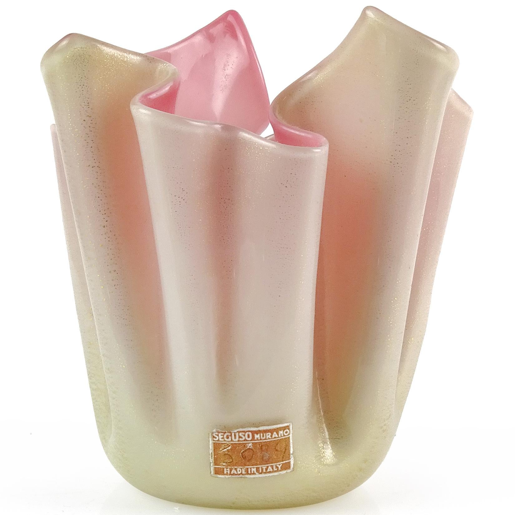 Beautiful vintage Murano hand blown white over pink, and gold flecks Italian art glass sculptural fazzoletto vase. Documented to the Seguso Vetri d'Arte company, with the original label still attached (used from 1940s-early 1960s). It is profusely