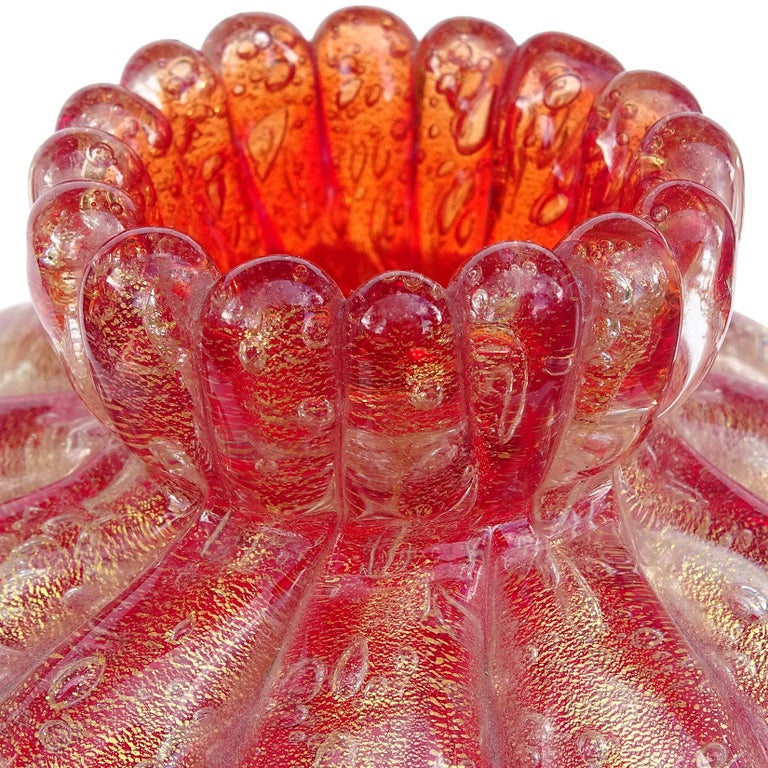 Beautiful vintage Murano hand blown red and gold flecks Italian art glass ribbed flower vase. Documented to the Seguso Vetri d'Arte company. Published in the company book, with model number 9774, circa 1954-1955. Created in the 