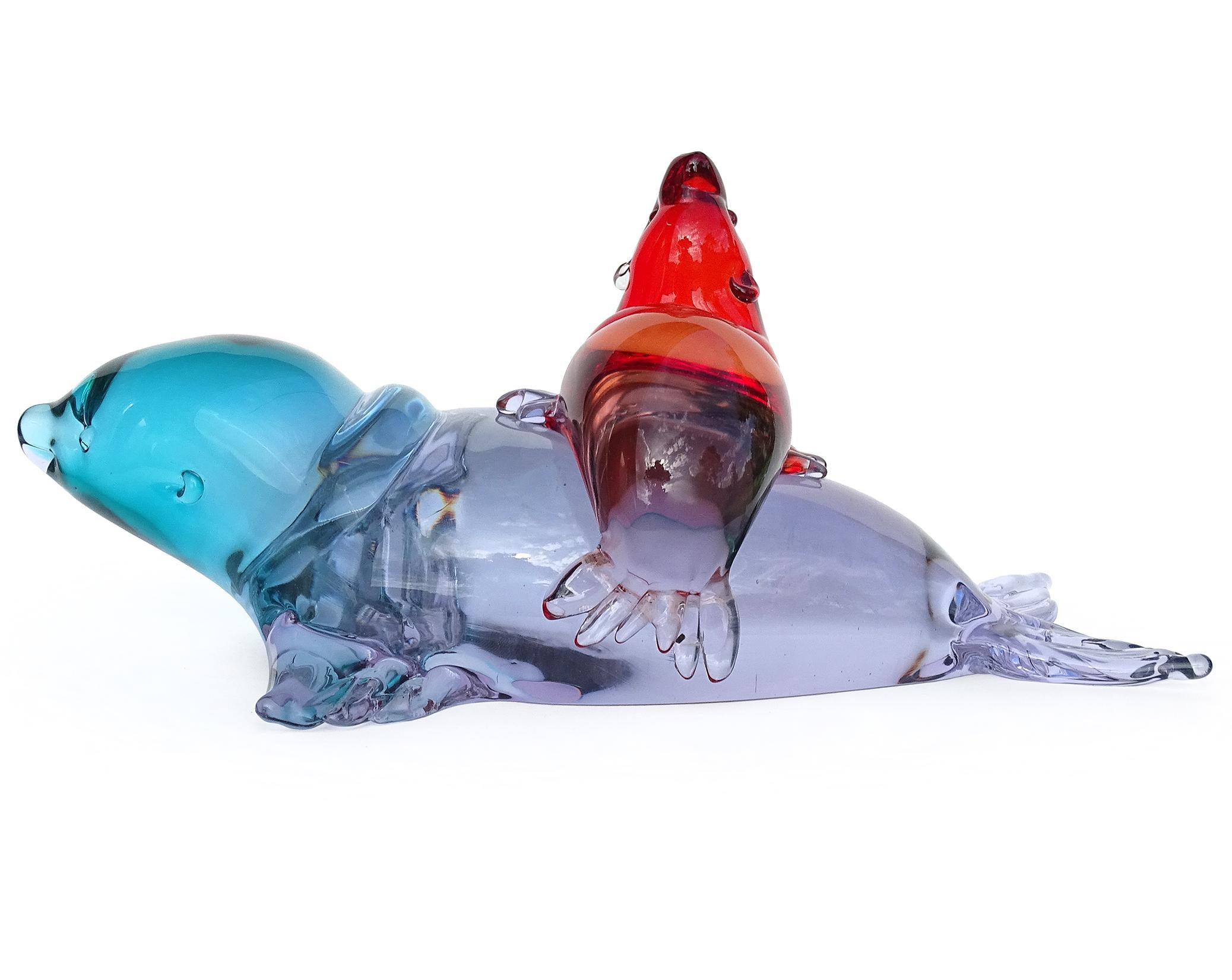 Beautiful large, vintage Murano hand blown Sommerso red and blue / purple “Alexandrite” Italian art glass mom seal and pup sculpture. Documented to the Seguso Vetri d'Arte company, recently found on their illustrated archives, item number 14752 (see
