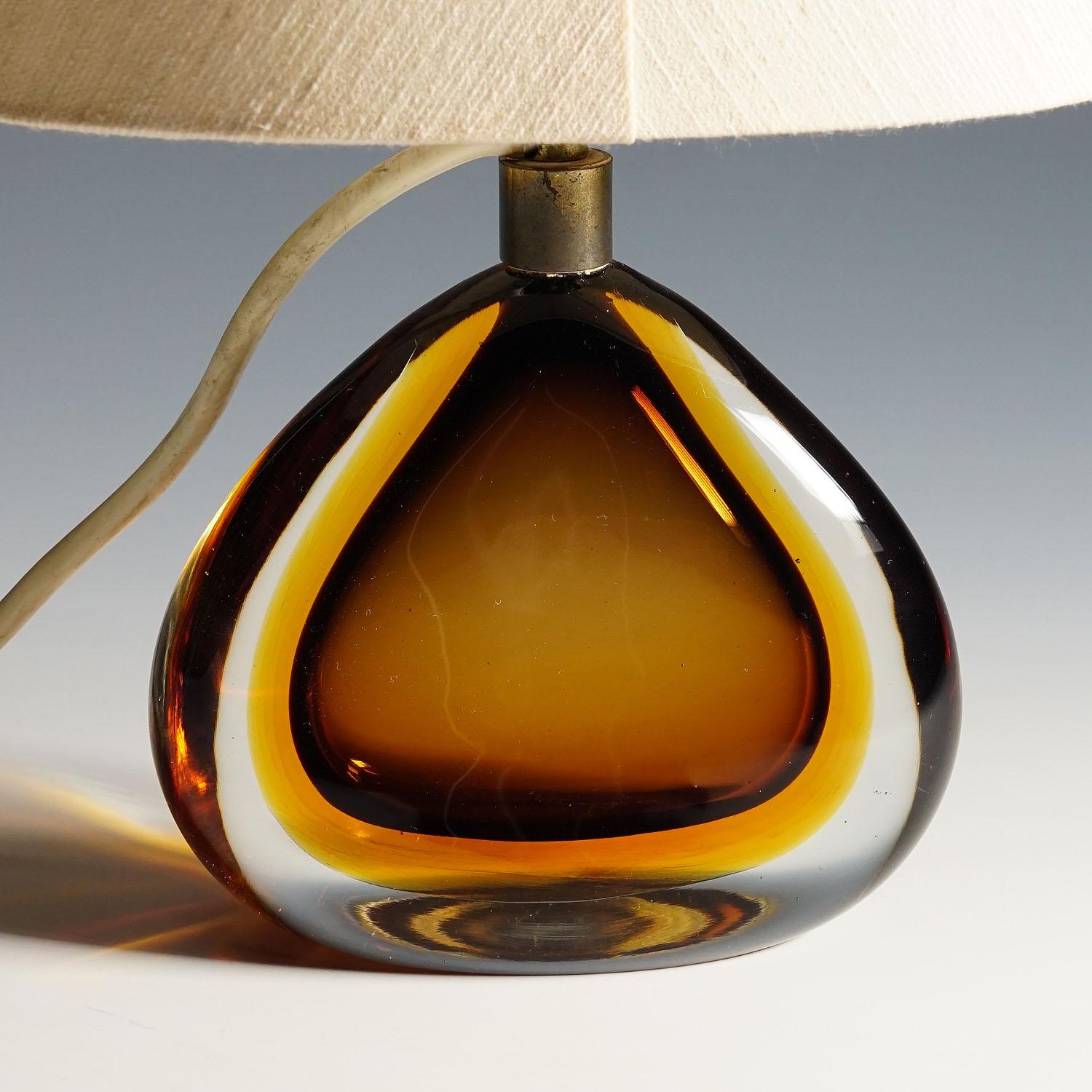 Seguso Vetri d'Arte Murano Sommerso Glass Lamp, 1960s

A vintage Murano sommerso art glass lamp. Designed by Flavio Poli and manufactured by Seguso Vetri d'Arte circa 1960s. Manufactured in thick yellow glass with a burnt topaz inlay. A rare
