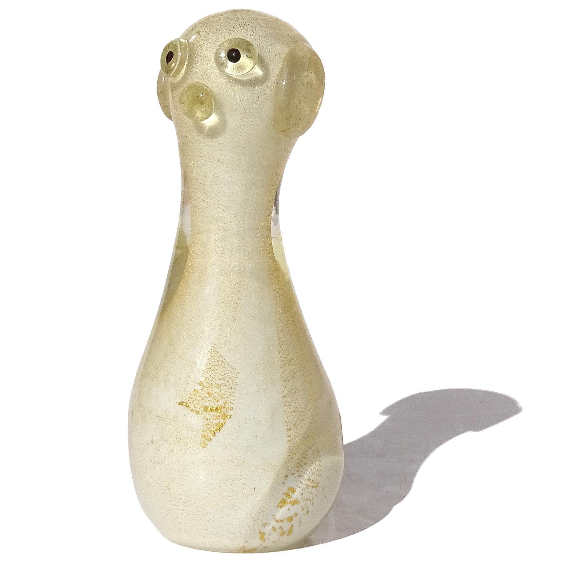 Beautiful vintage Murano hand blown white and gold flecks Italian art glass puppy dog figurine sculpture. Documented to the Seguso Vetri d'Arte company, recently found on their illustrated archives, item number 12990. The little dog is profusely