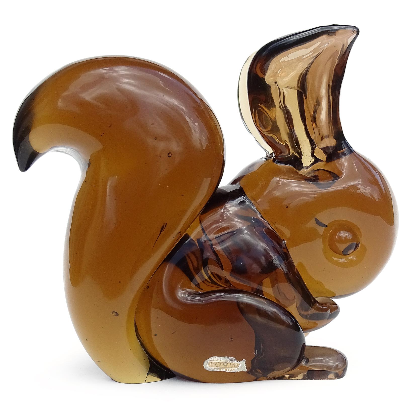 Beautiful, rare, and cute vintage Murano hand blown Sommerso amber brown Italian art glass squirrel figure / sculpture. Documented to designer Flavio Poli for the Seguso Vetri d'Arte company, circa 1950s. Published design in any books and the