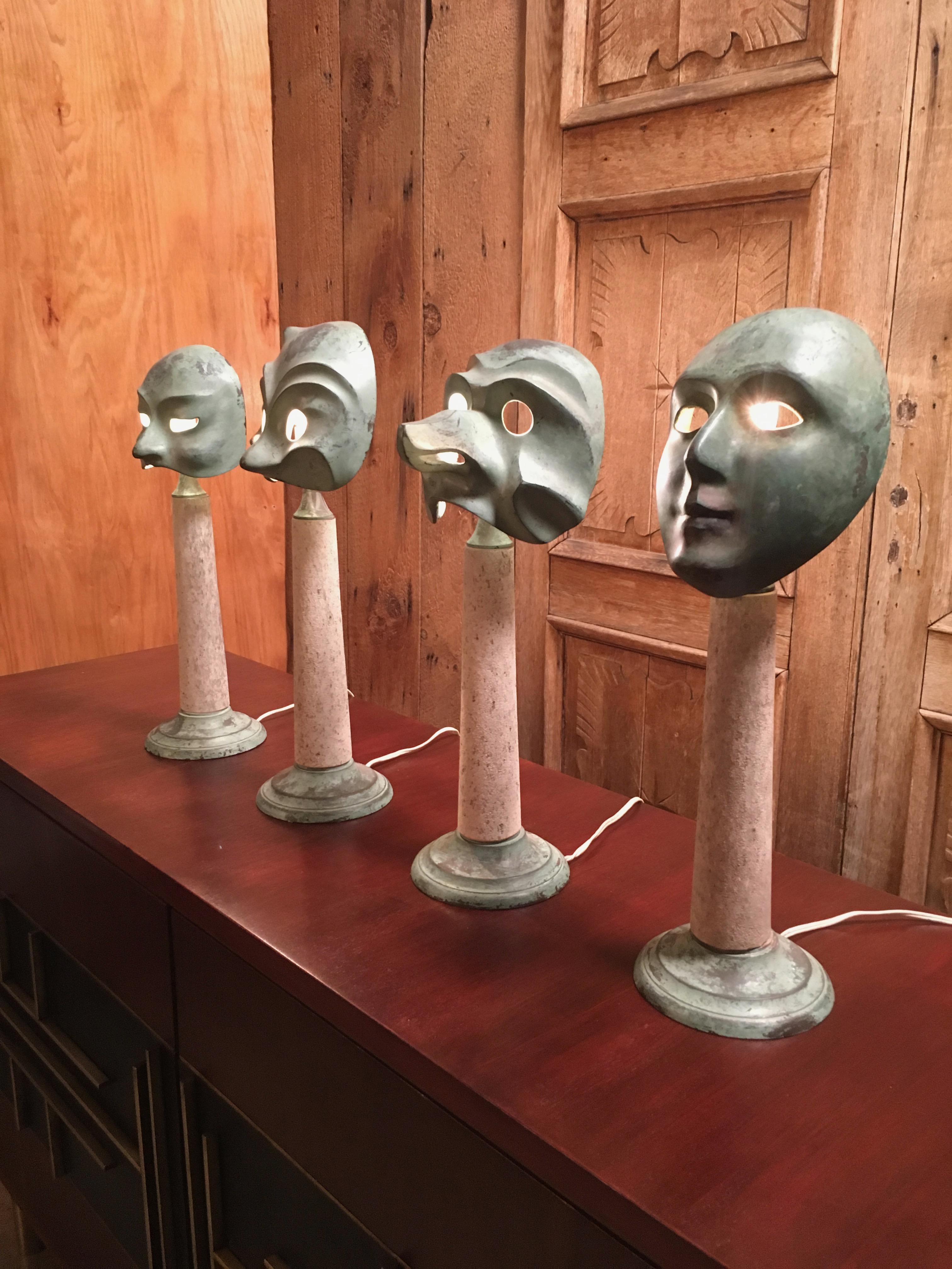 Theater mask table lamps designed by Elin Raaberg Nielsen for Seguso Vetri D’Arte from the “Le Maschere” series. All pieces were crafted during the 1970s in Murano, Italy in antique patinated bronze.

Measurements (left to right):
Oriental 18.75