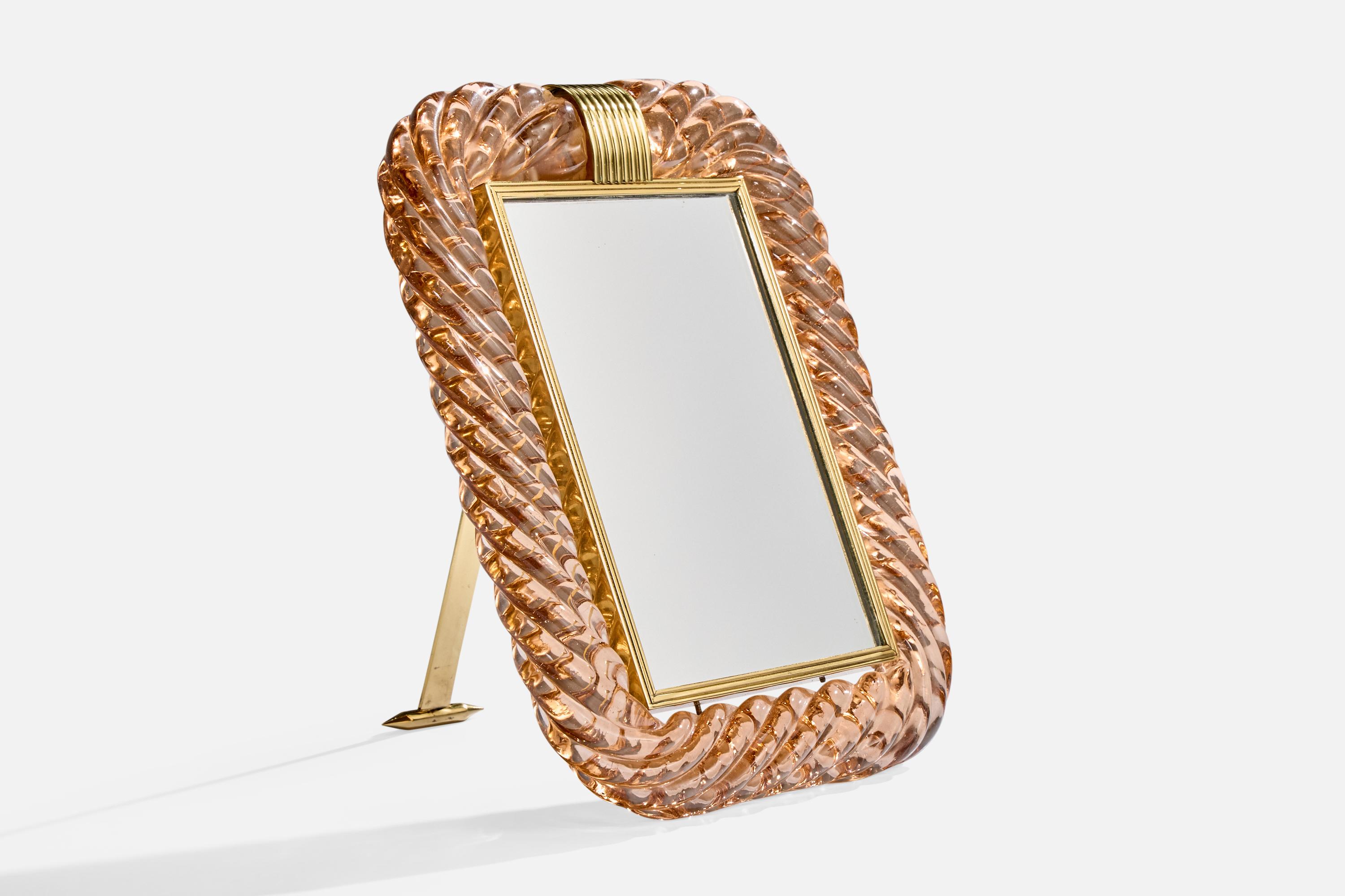 A pink murano glass and brass table mirror produced by Seguso Vetri D'arte, Italy, c. 1930s.

Overall Dimensions (inches): 12.5