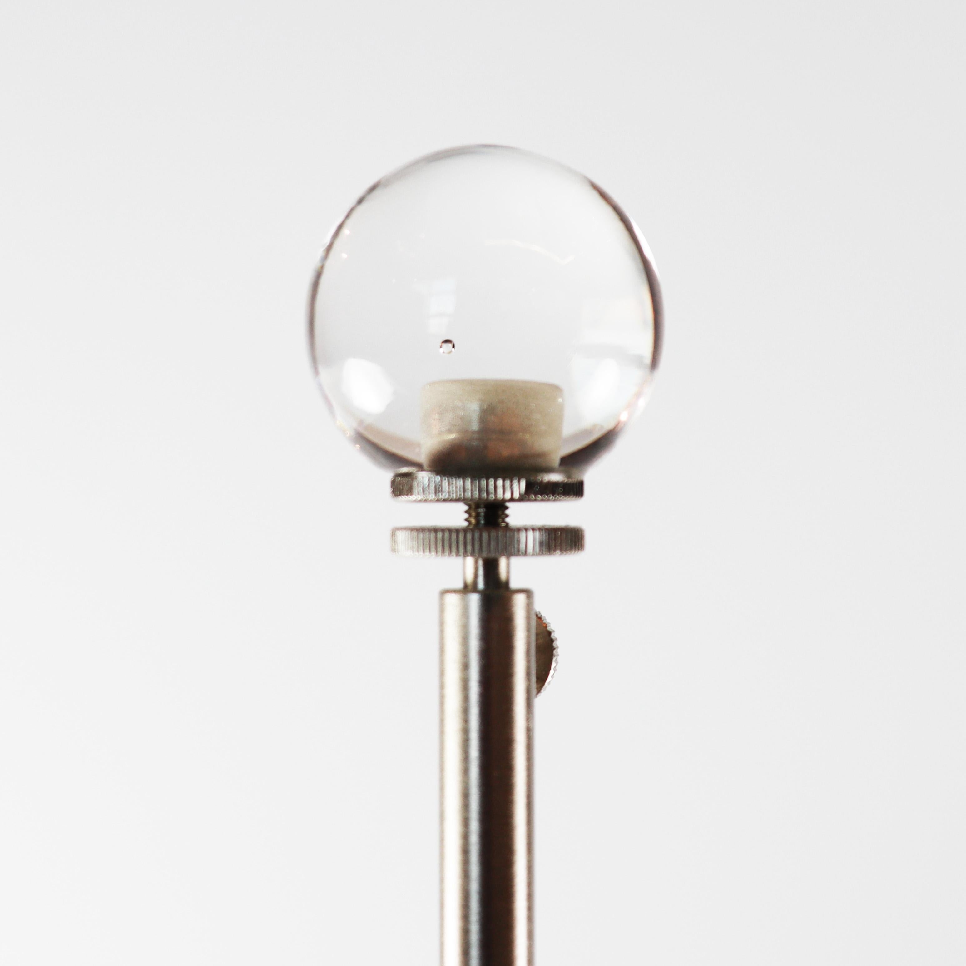 Murano glass table lamp by Seguso Vetri d’Arte. Handmade from mouth-blown transparent glass, with a tapered stem and a flared base. The stem is decorated with a twisted ribbed design. Available with your choice of a black or white lampshade.