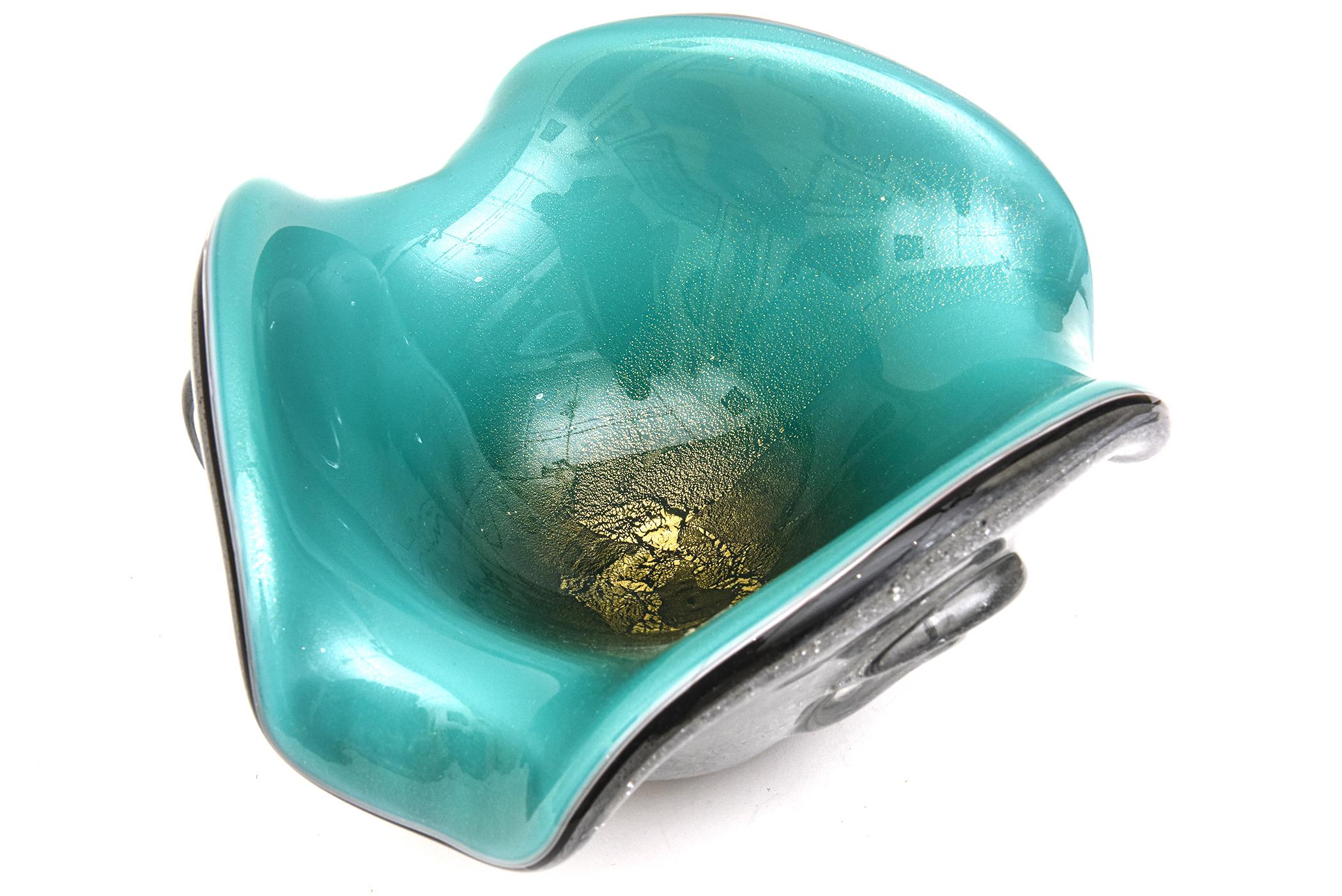 This substantial stunning and hard to find hand blown glass vintage Murano bowl is by Seguso Vetri d'Arte from the 50's. it is triple cased of glass layers with an abundance of bubbles noting the Pulegoso technique. There is still a partial original