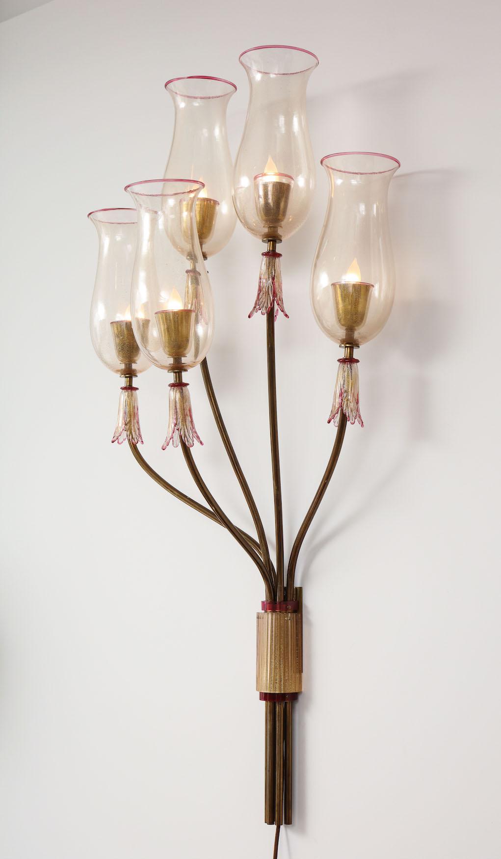 5 light wall sconce by Seguso Vetri d'Arte. Impressive scale single sconce. Gold Murano glass with red details. Each arm has a single standard Edison socket. Very good condition. All glass has been cleaned and all sockets and wiring have been